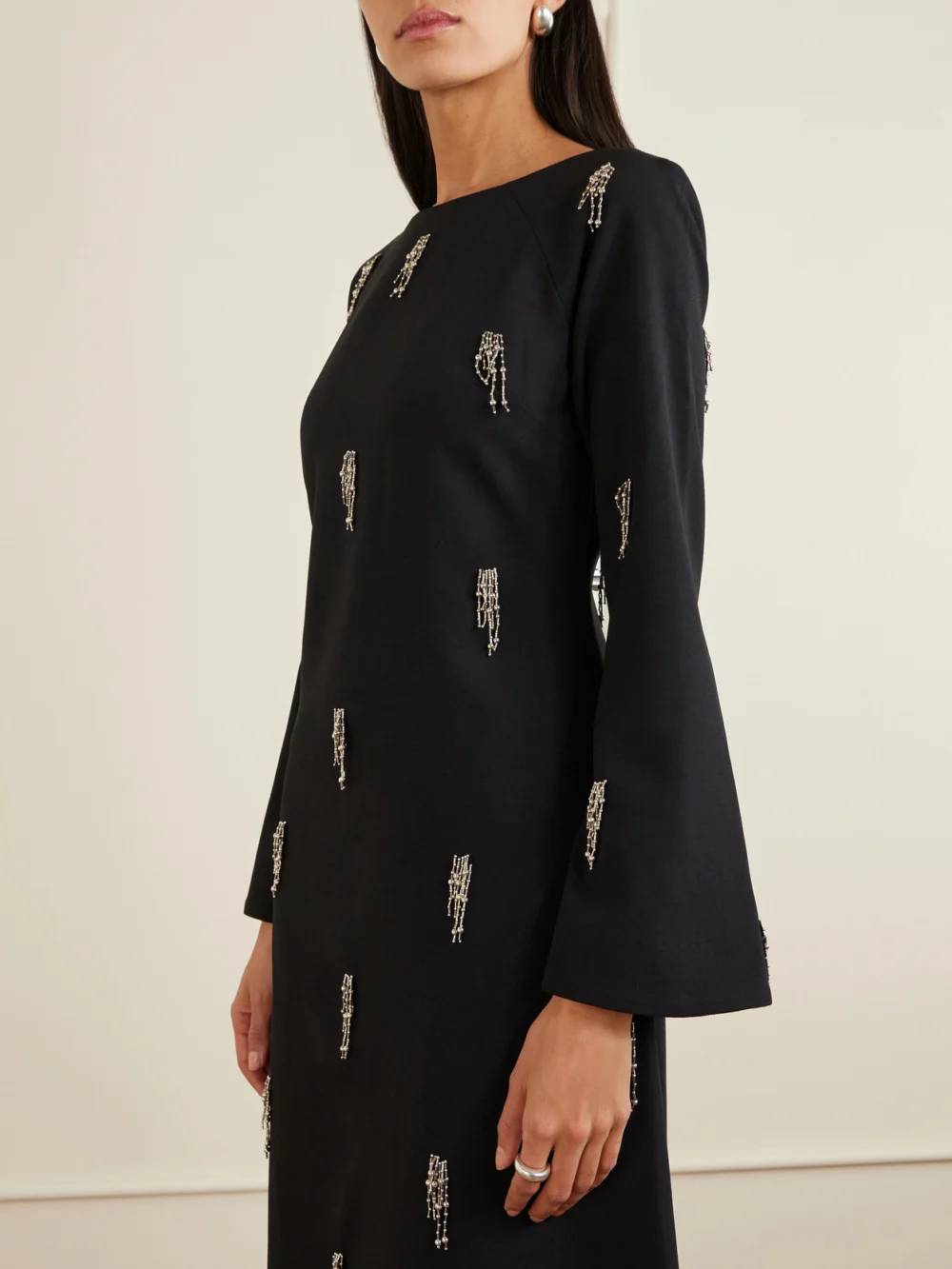 Close-up detail of the Simkhai Coretta Embellished Crepe Midi Dress