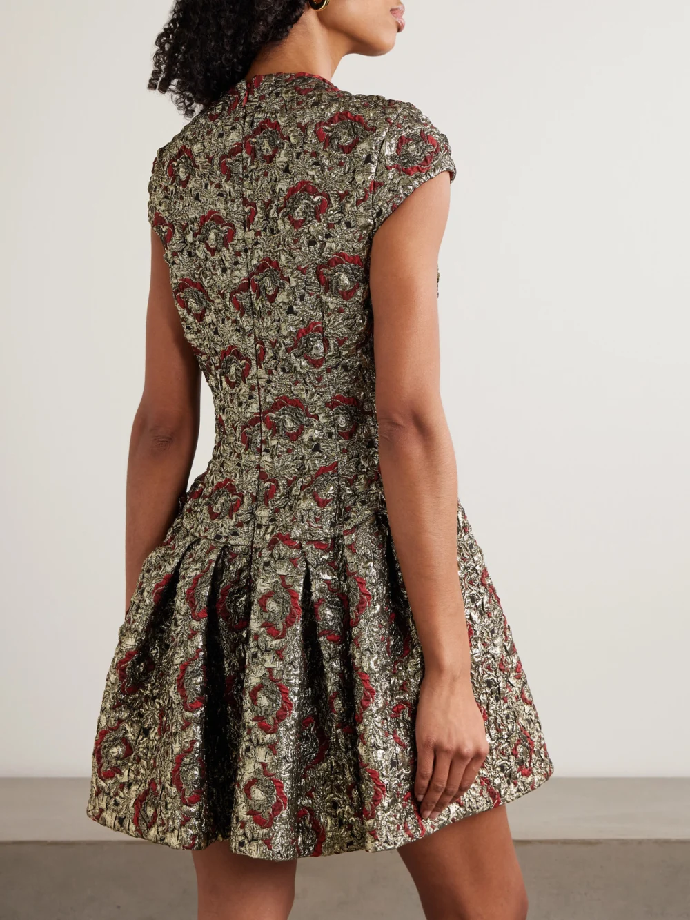 Back view of the Simkhai Elowen Pleated Metallic Jacquard Mini Dress