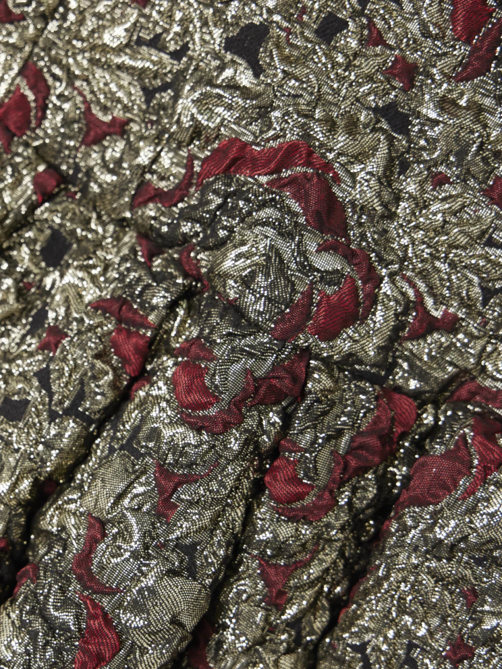Close-up detail of the Simkhai Elowen Pleated Metallic Jacquard Mini Dress
