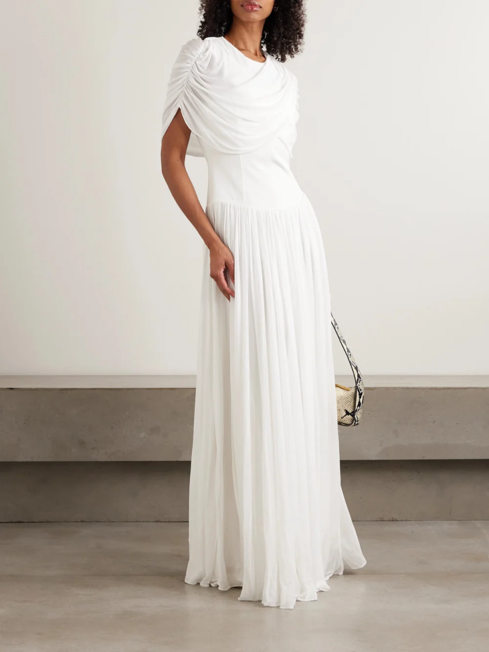 Simkhai Nancie Cape-effect Draped Pleated Jersey Maxi Dress, worn by a model