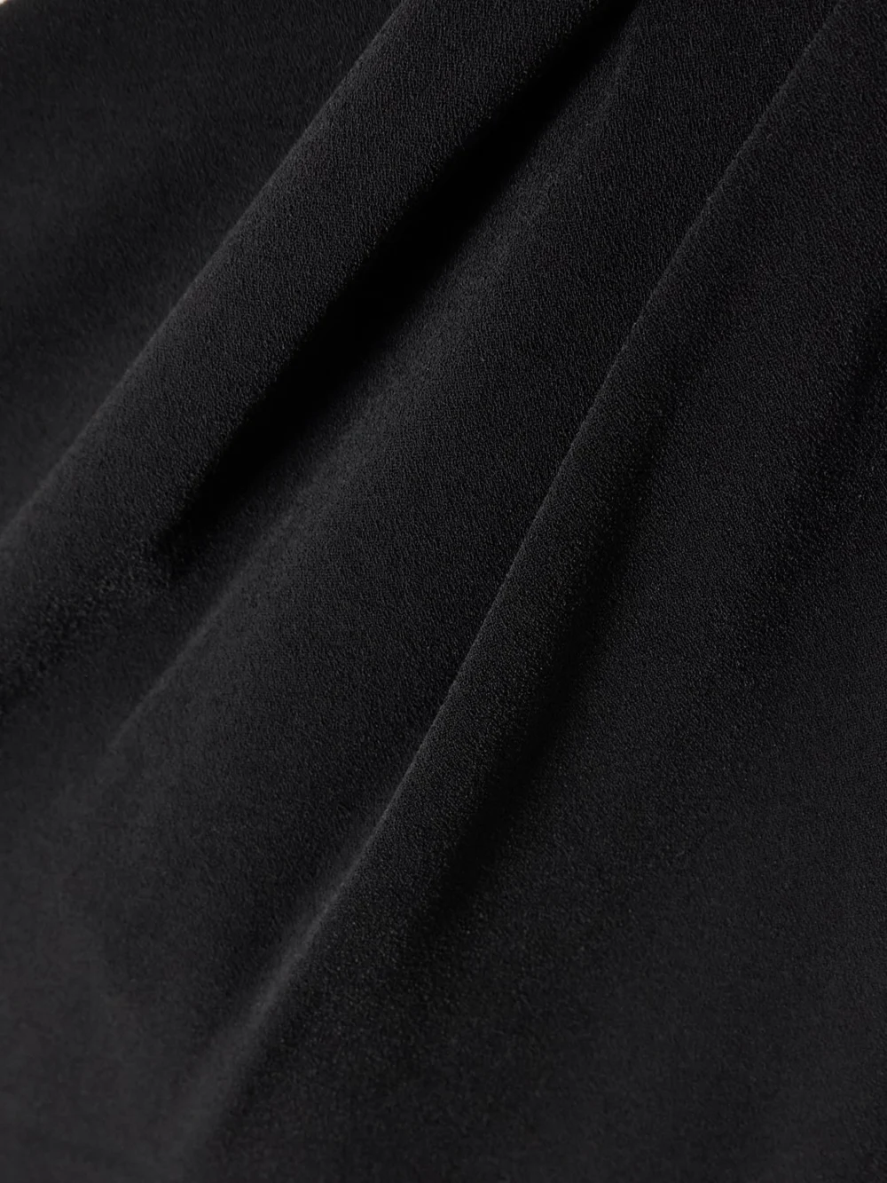 Close-up detail of the Solace London Irina Tie-detailed One-shoulder Crepe Gown