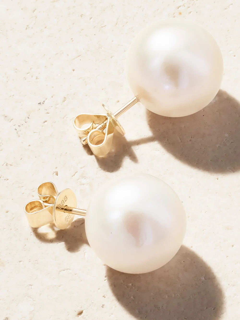 Close-up detail of the Sophie Bille Brahe Moon 14-karat Recycled Gold Pearl Earrings
