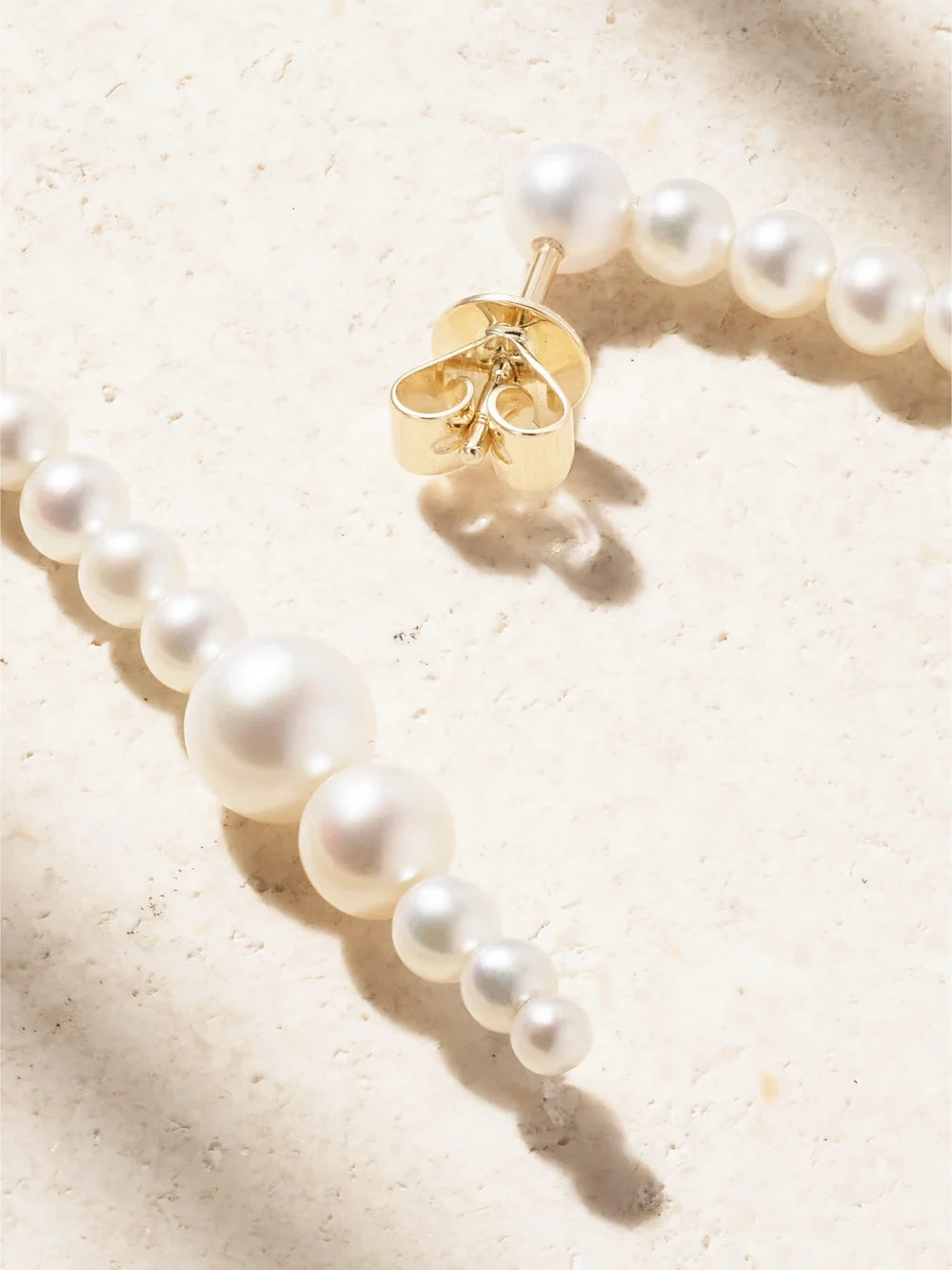 Close-up detail of the Sophie Bille Brahe Sienna Moon 14-karat Recycled Gold Pearl Earrings