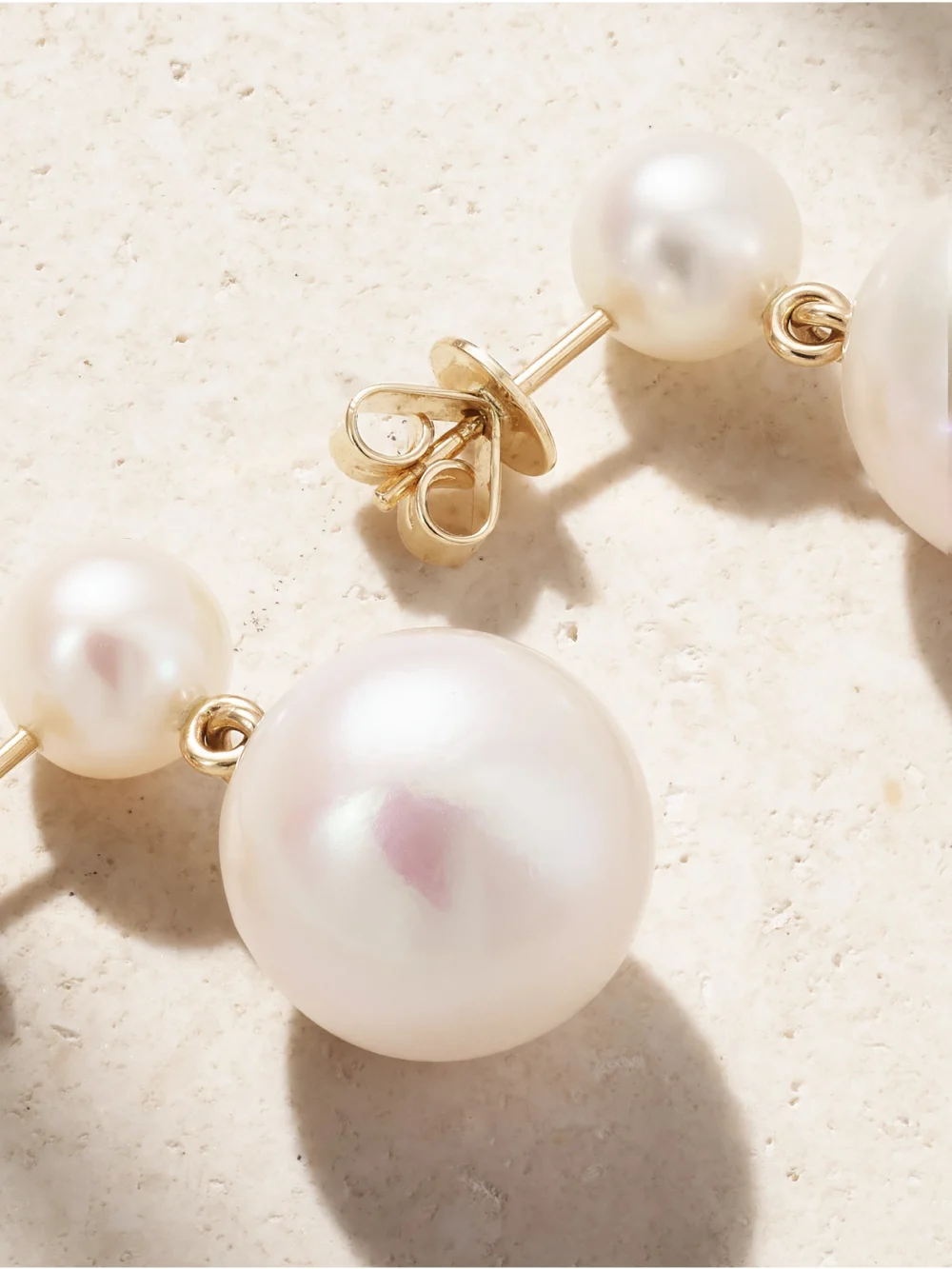 Close-up detail of the Sophie Bille Brahe Venus Moon 14-karat Recycled Gold Pearl Earrings