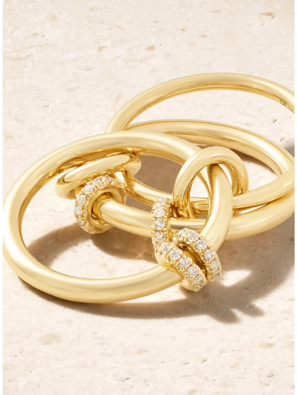 Close-up detail of the Spinelli Kilcollin Jovie Set of Three 18-karat Gold Diamond Rings