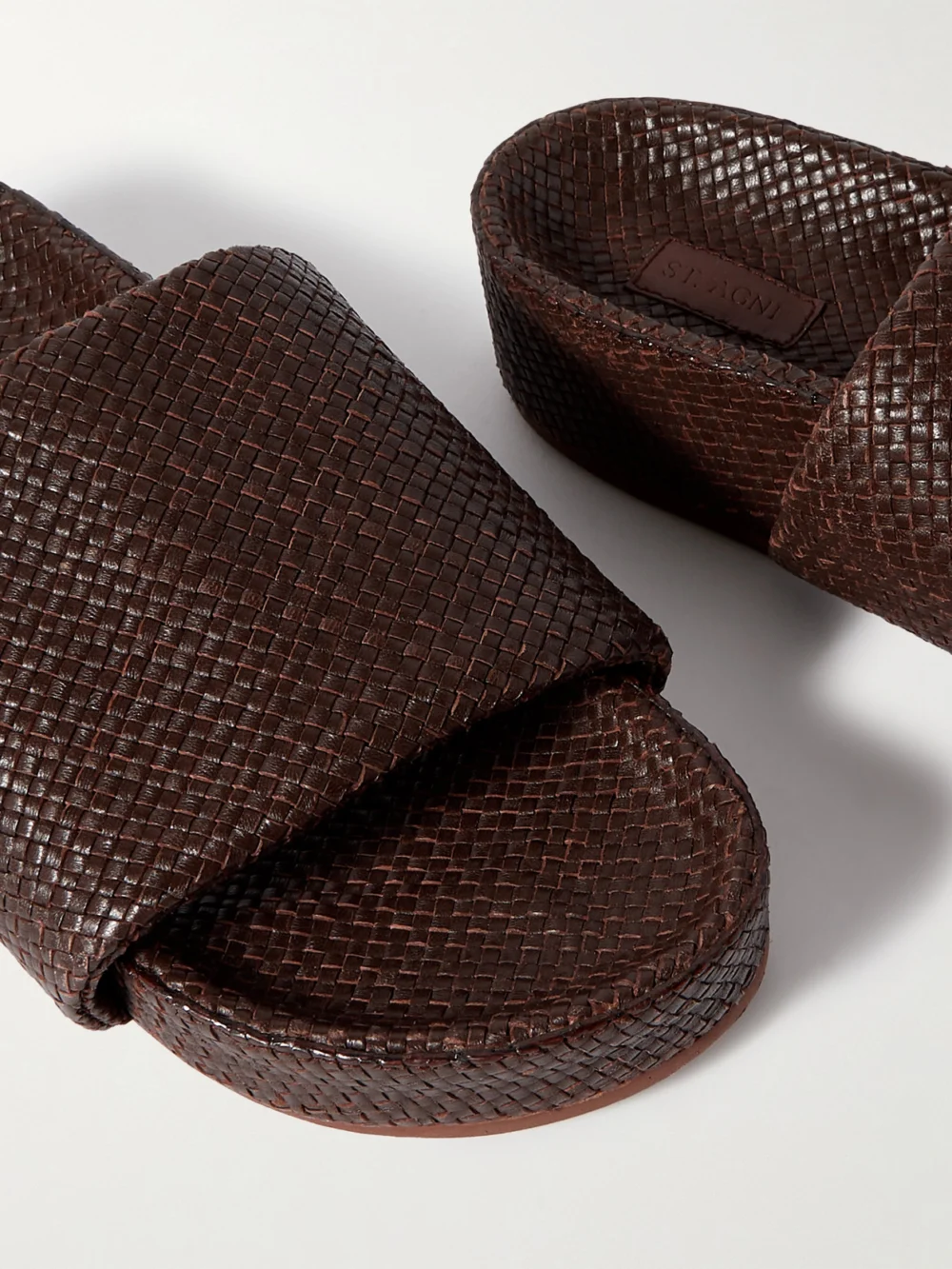 Close-up detail of the St. Agni Woven Leather Platform Slides