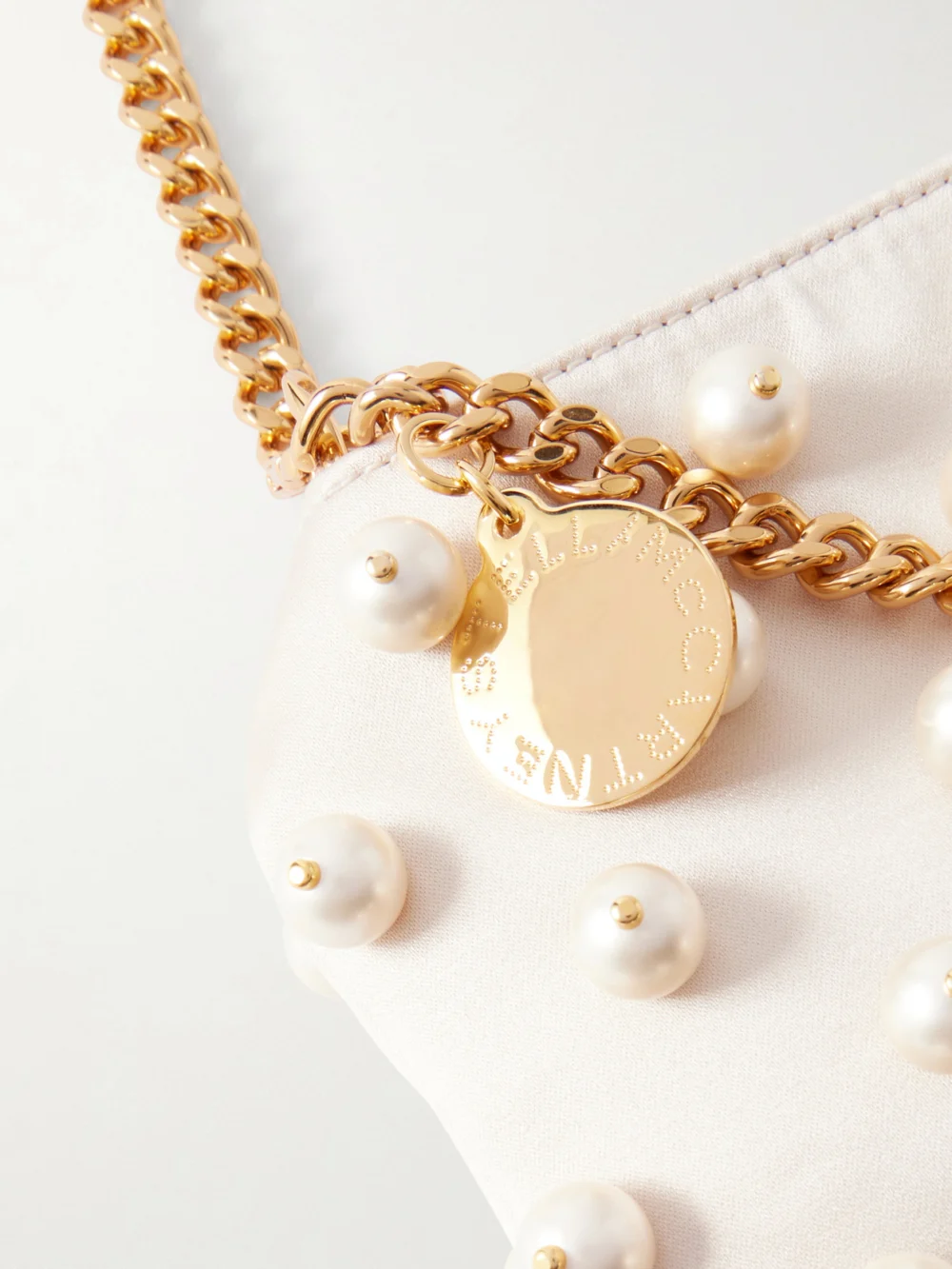 Close-up detail of the Stella McCartney Falabella Mini Embellished Satin Shoulder Bag