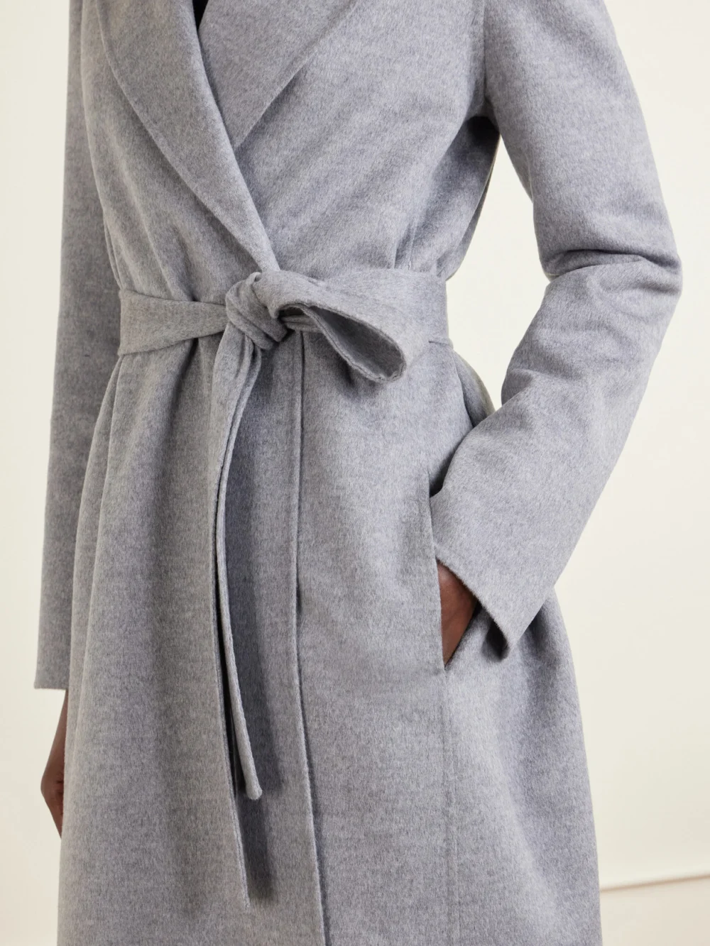 Close-up detail of the Stella McCartney Iconic Stella Belted Wool Coat