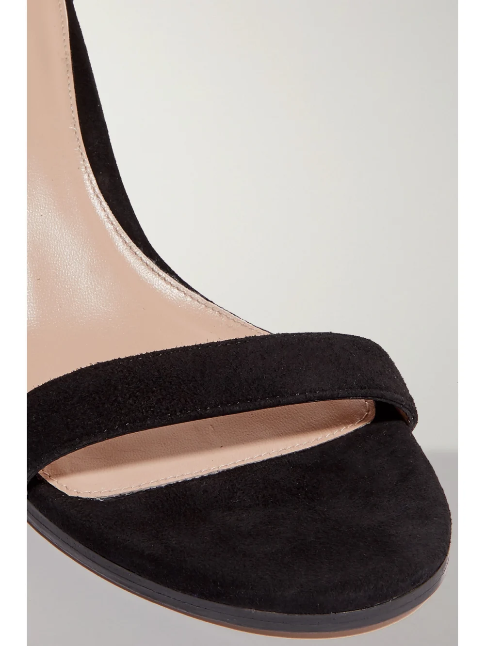 Close-up detail of the Stuart Weitzman Nearlynude Suede Sandals