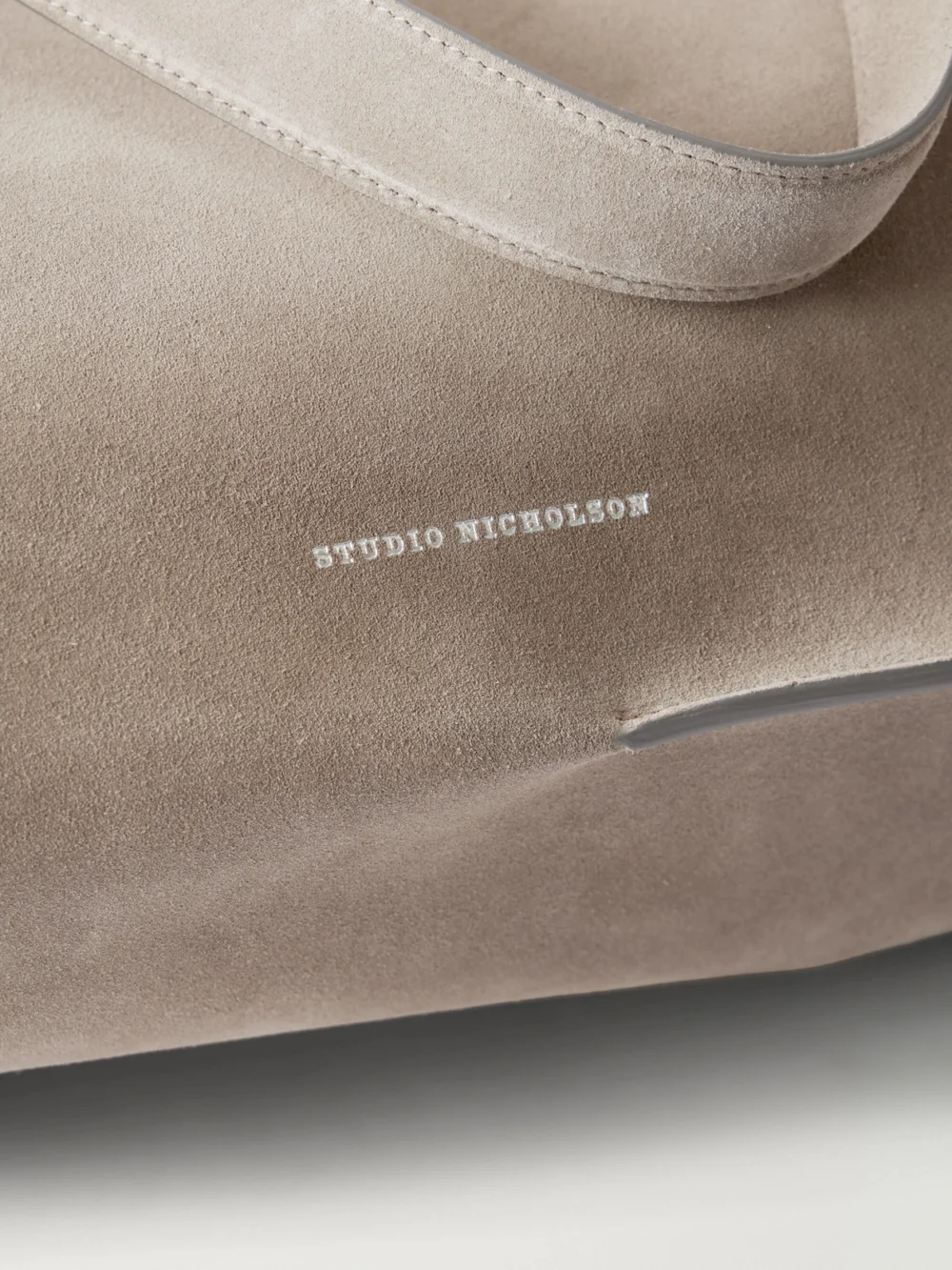 Close-up detail of the Studio Nicholson The Reflection Suede Tote