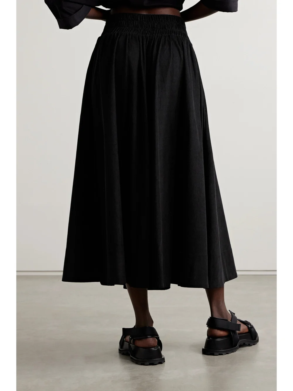 Back view of the Suzie Kondi The Kyria Pleated Cotton-corduroy Midi Skirt