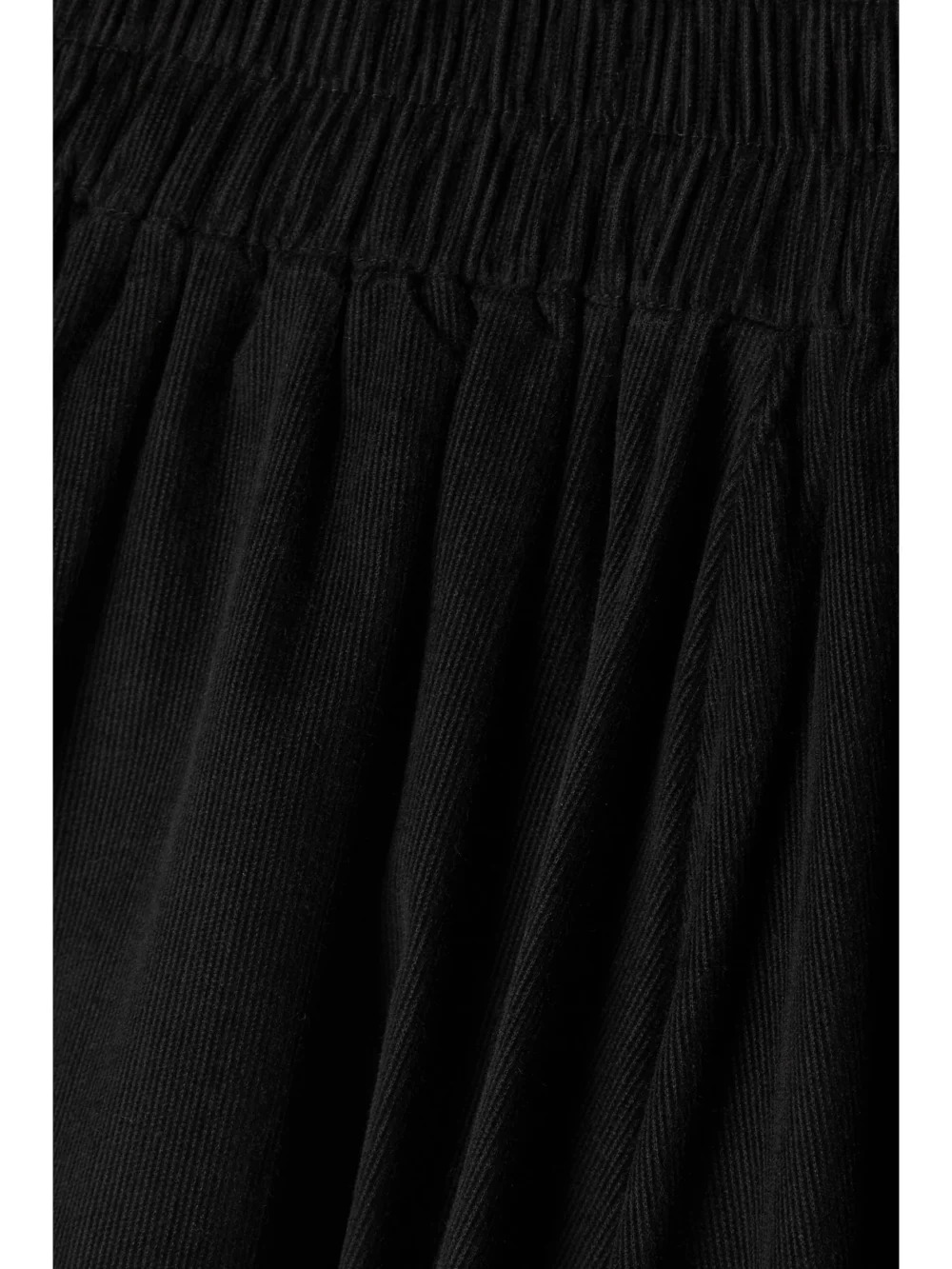 Close-up detail of the Suzie Kondi The Kyria Pleated Cotton-corduroy Midi Skirt
