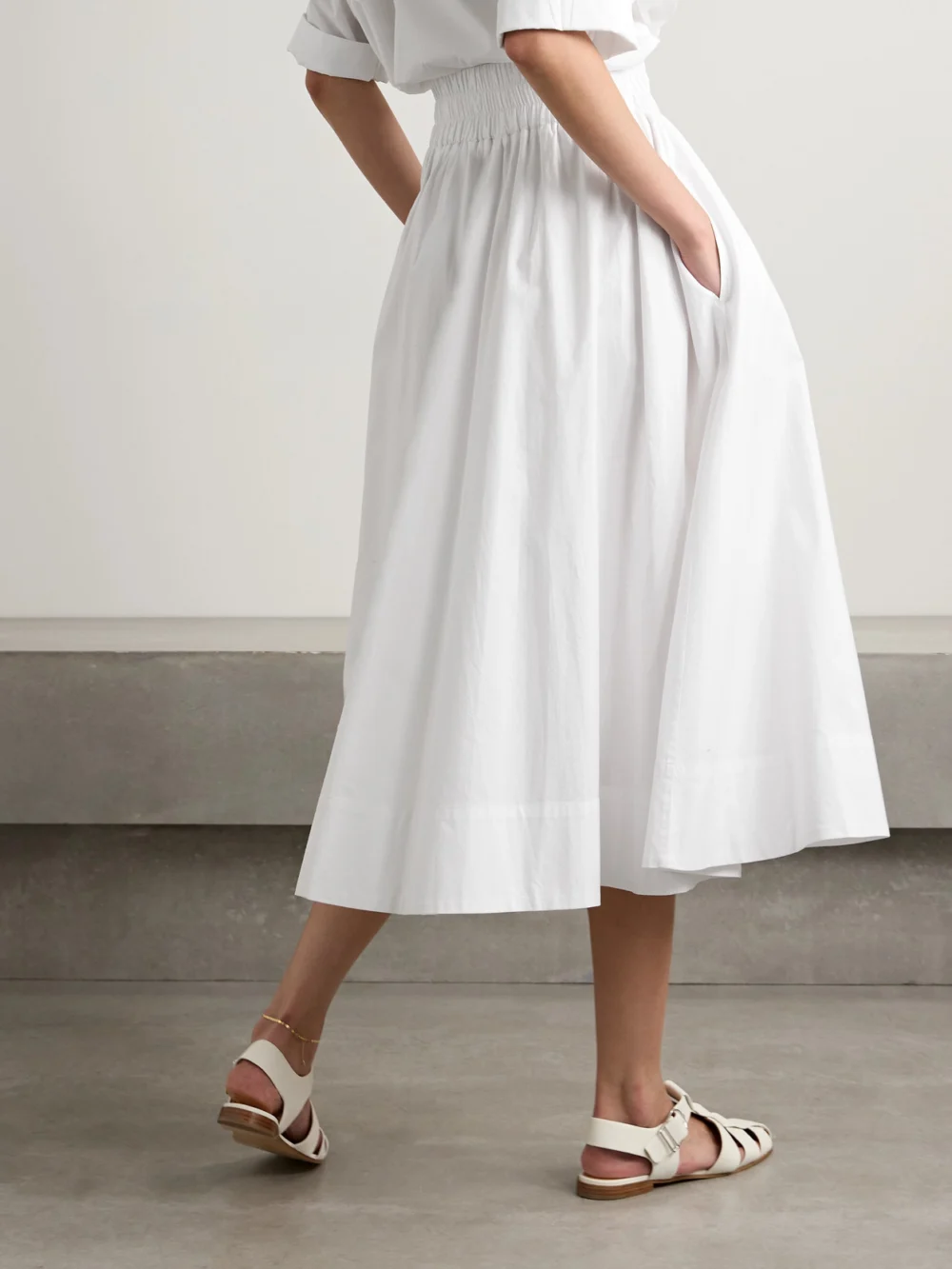 Back view of the Suzie Kondi The Kyria Pleated Cotton-poplin Midi Skirt
