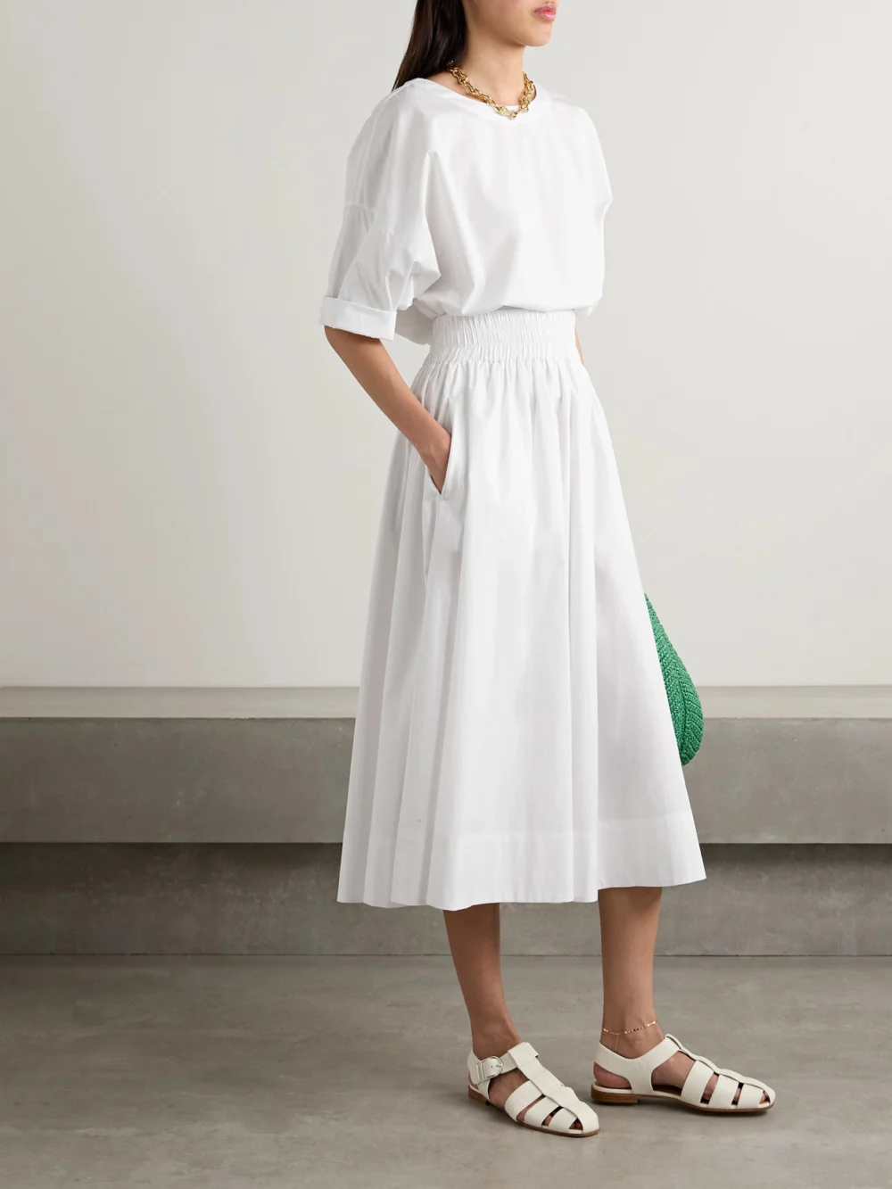 Suzie Kondi The Kyria Pleated Cotton-poplin Midi Skirt, worn by a model