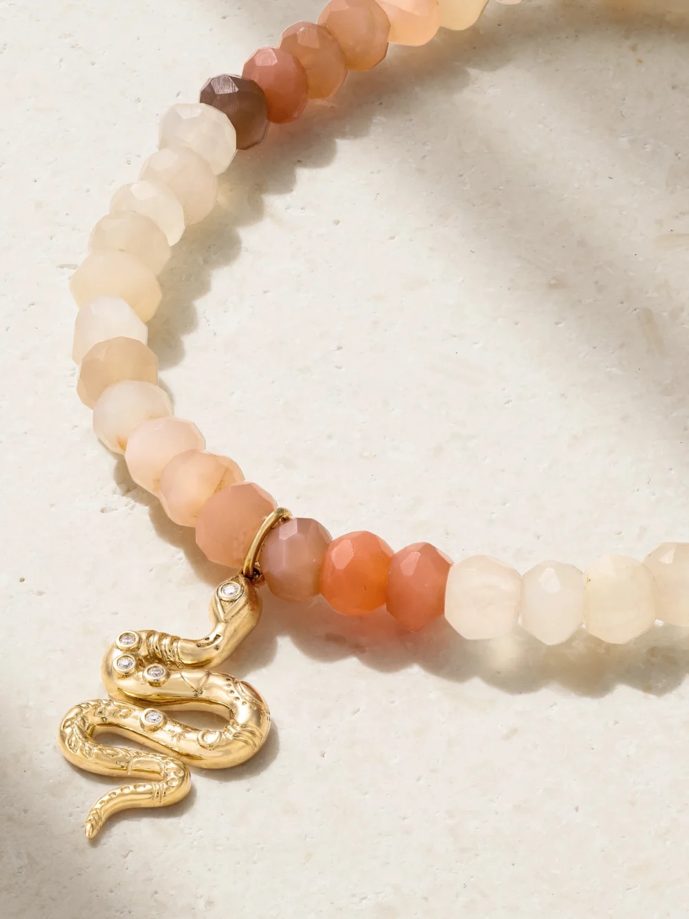 Close-up detail of the Sydney Evan Snake 14-karat Gold, Moonstone and Diamond Bracelet