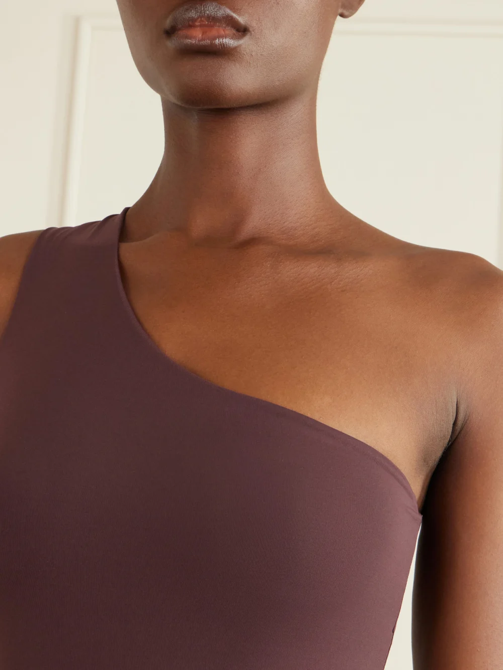 Close-up detail of the Taller Marmo Rhodes One-shoulder Swimsuit and Fringed Pareo Set