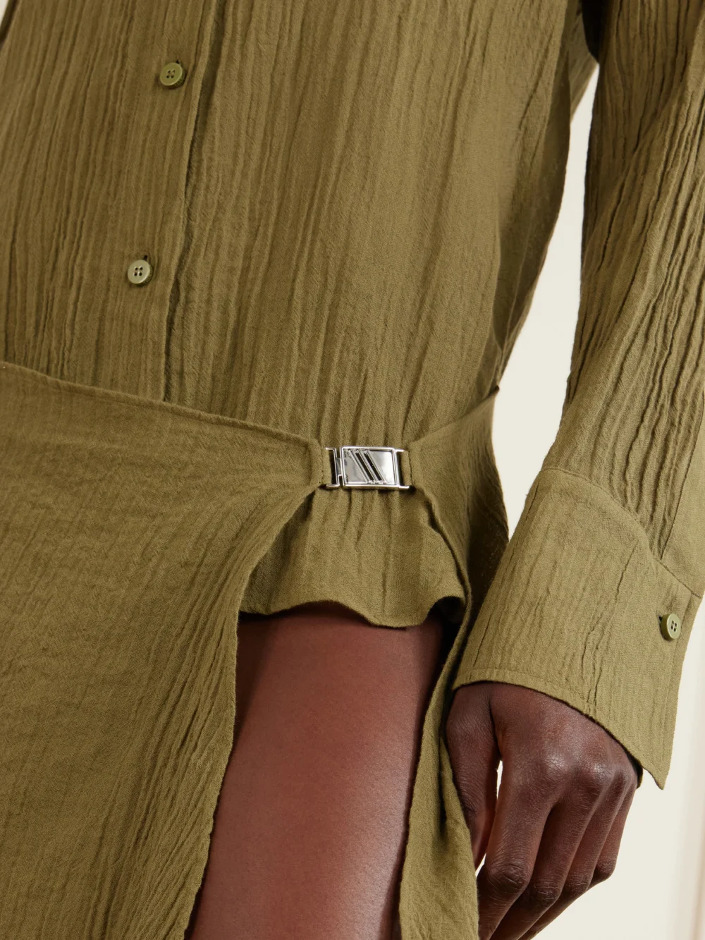 Close-up detail of The Attico Asymmetric Cotton Mini Dress