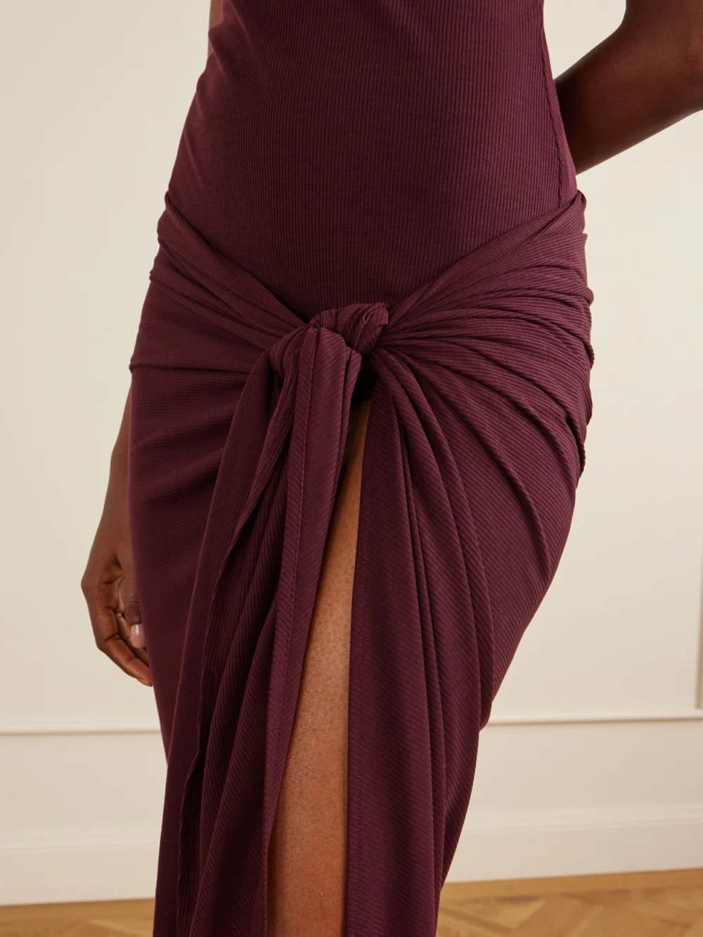 Close-up detail of The Attico Knotted Ribbed Lyocell Midi Dress