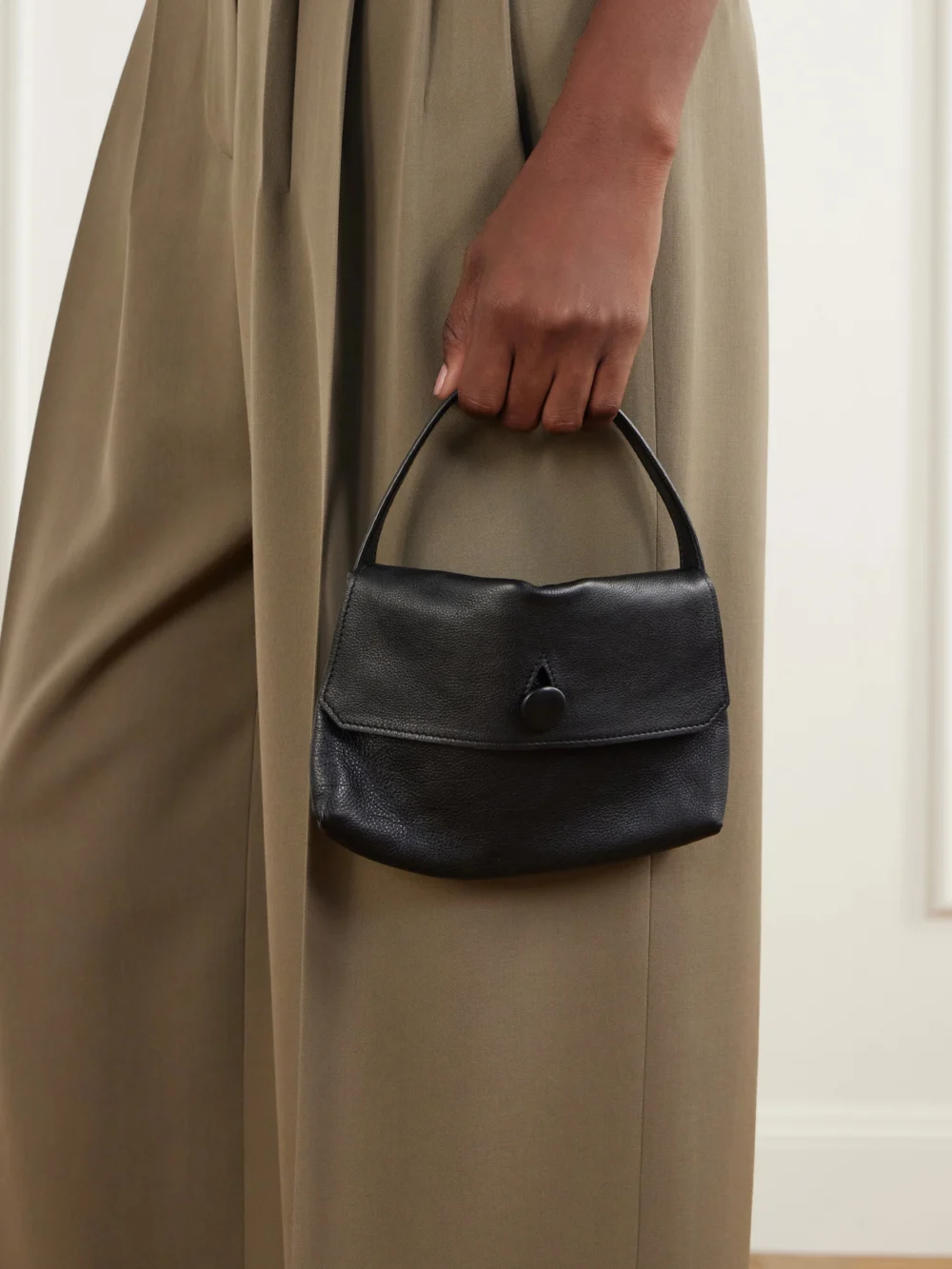 The Row Sally Ody Leather Shoulder Bag, styled view