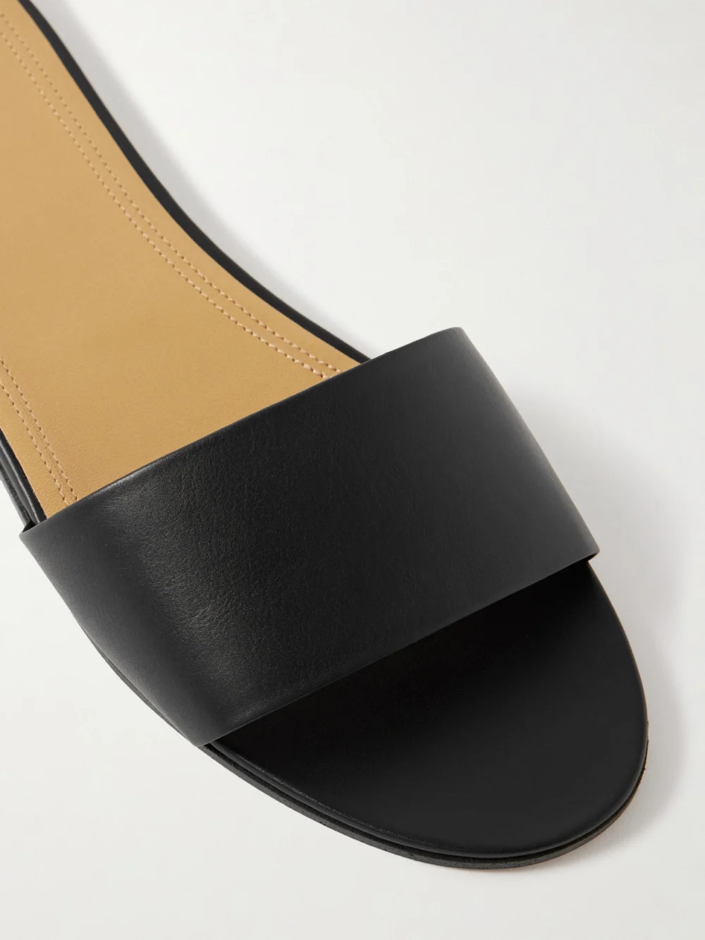 Close-up detail of The Row Signum Leather Slides