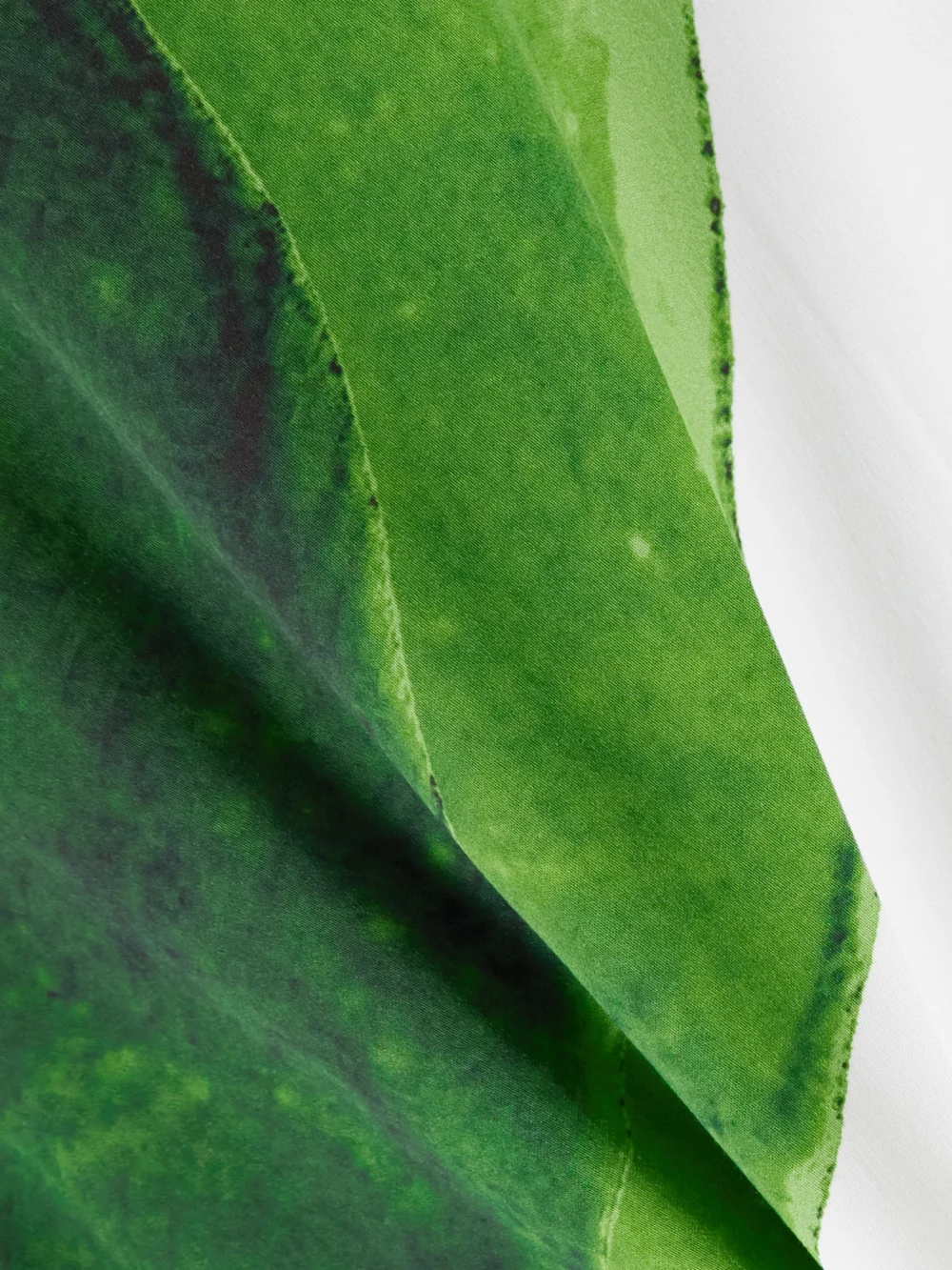 Close-up detail of the Themis Z Artemis Chain-embellished Printed Jersey Midi Dress