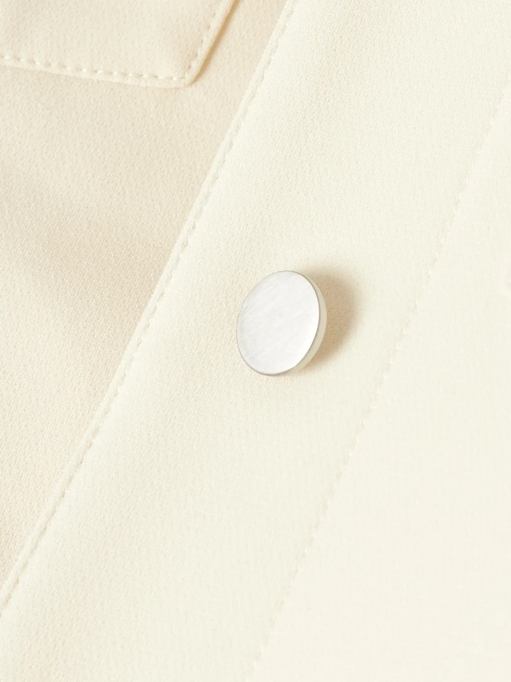 Close-up detail of the Theory Shrunken Trucker Cropped Crepe Jacket