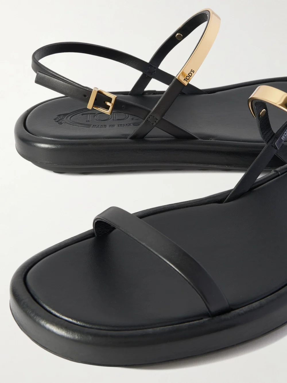 Close-up detail of the Tod's Embellished Leather Slingback Sandals