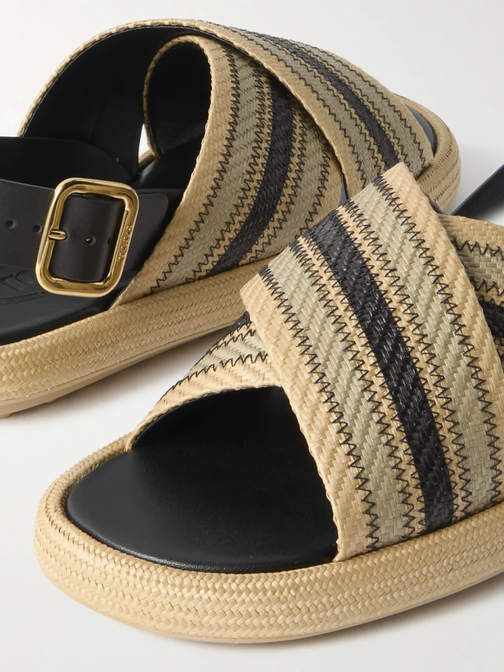 Close-up detail of the Tod's Leather-trimmed Striped Raffia Sandals