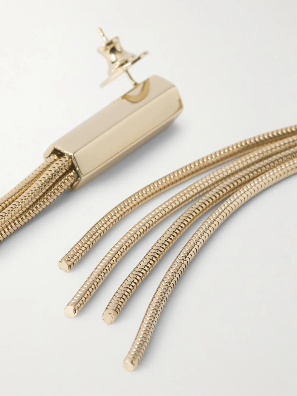 Close-up detail of the Tom Ford Fringed Gold-tone Earrings