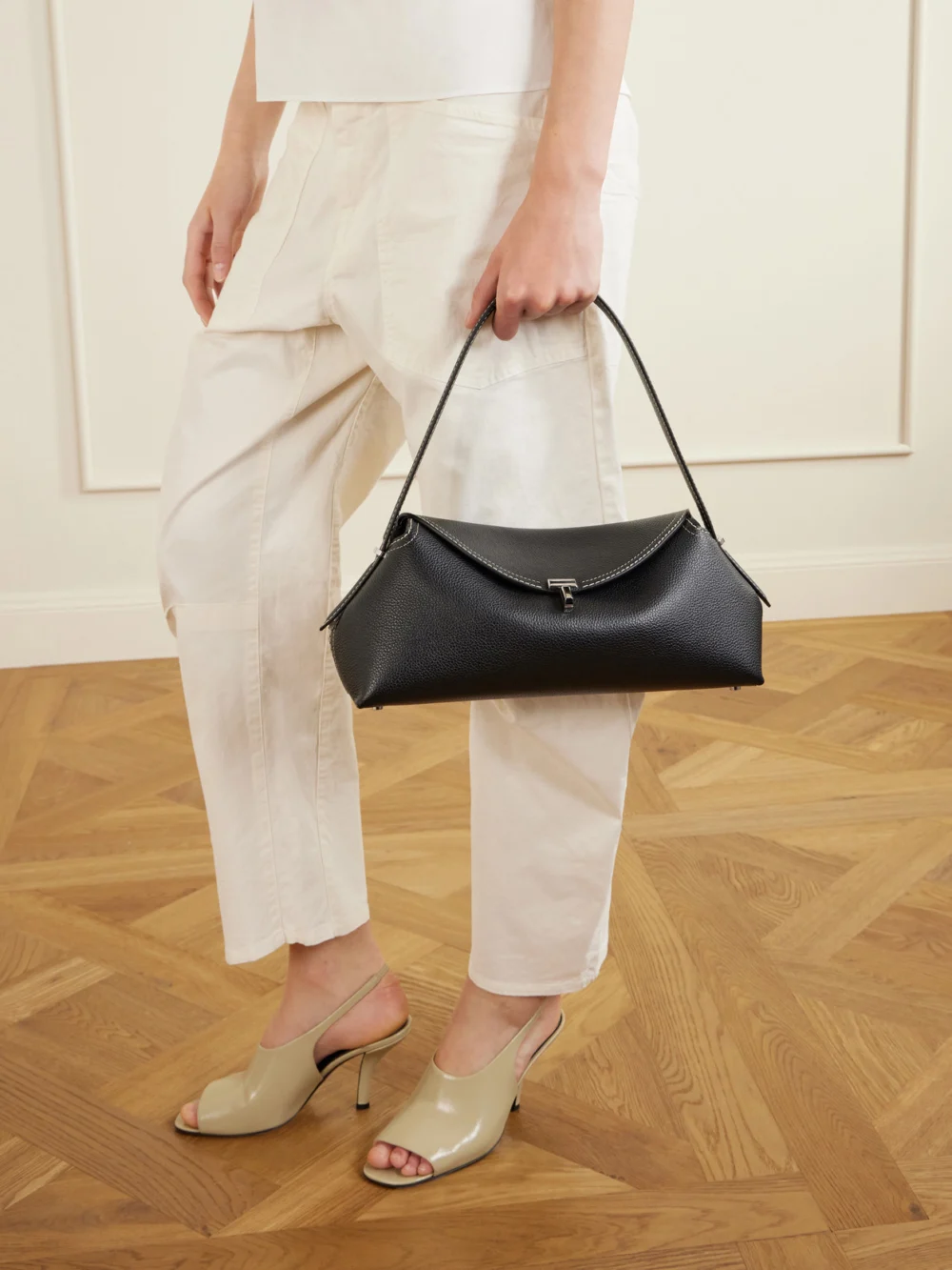 Totême T-lock Full-grain Leather Shoulder Bag, styled view