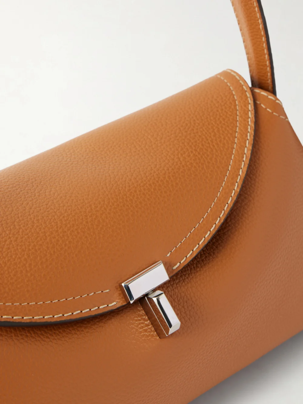 Close-up detail of the Totême T-lock Full-grain Leather Shoulder Bag