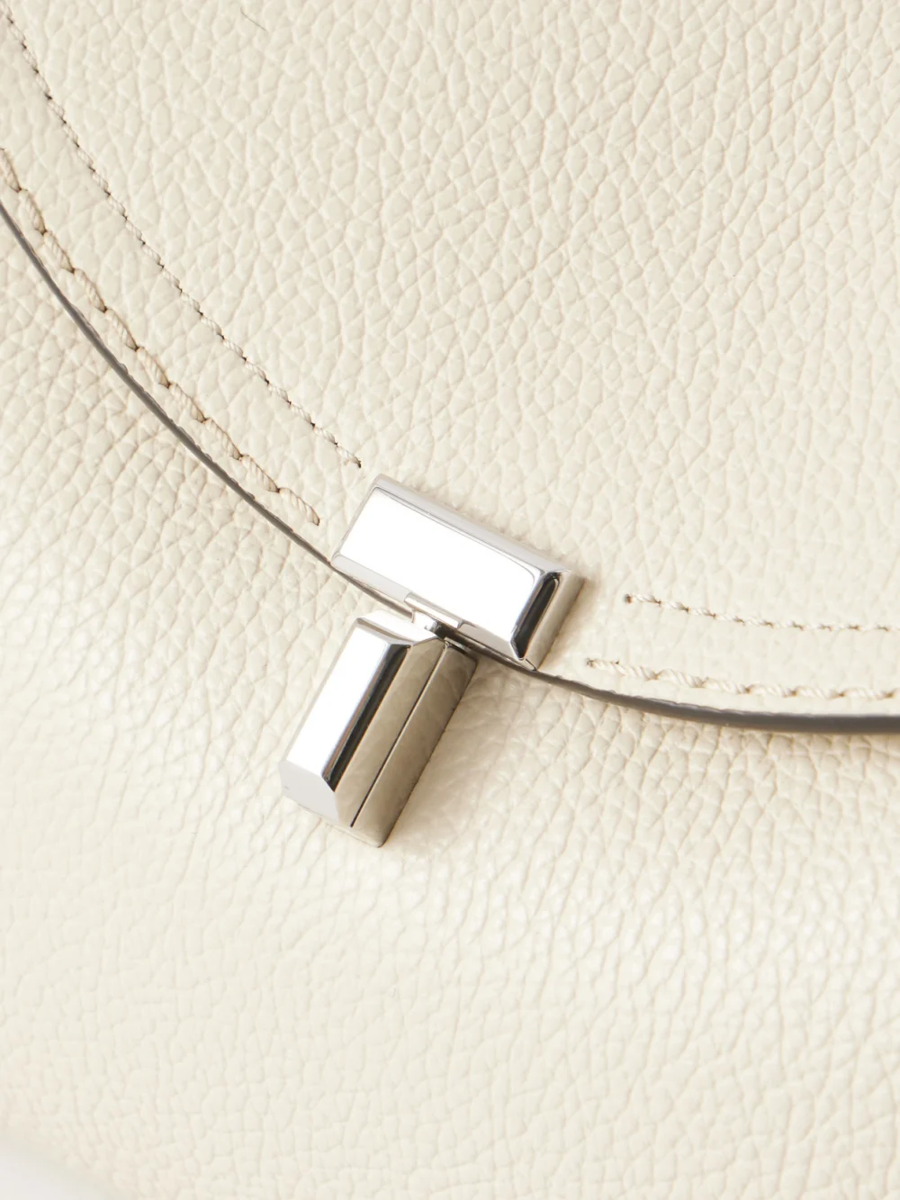 Close-up detail of the Totême T-lock Leather Shoulder Bag