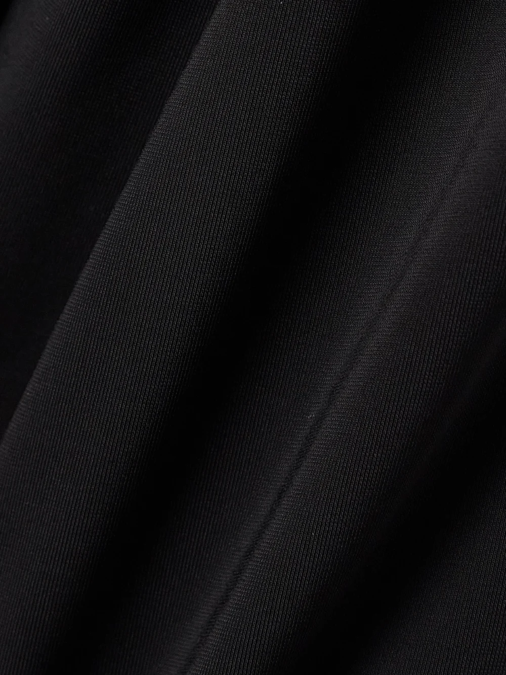 Close-up detail of the Tove Mika Embellished Stretch-knit Halterneck Maxi Dress