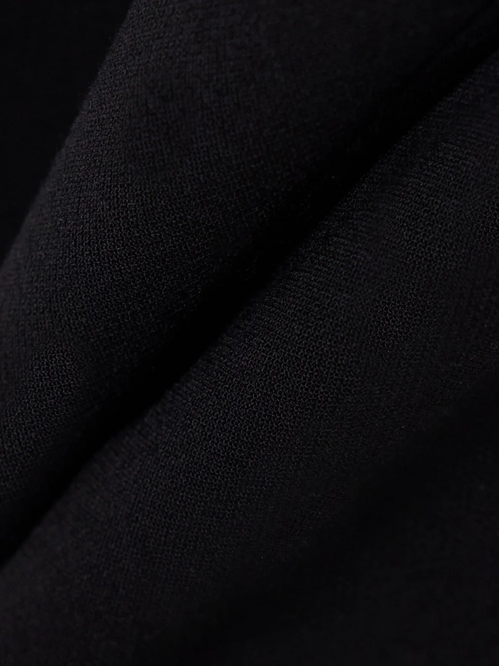 Close-up detail of the Tove Talia Cropped Pleated Crepe Flared Pants