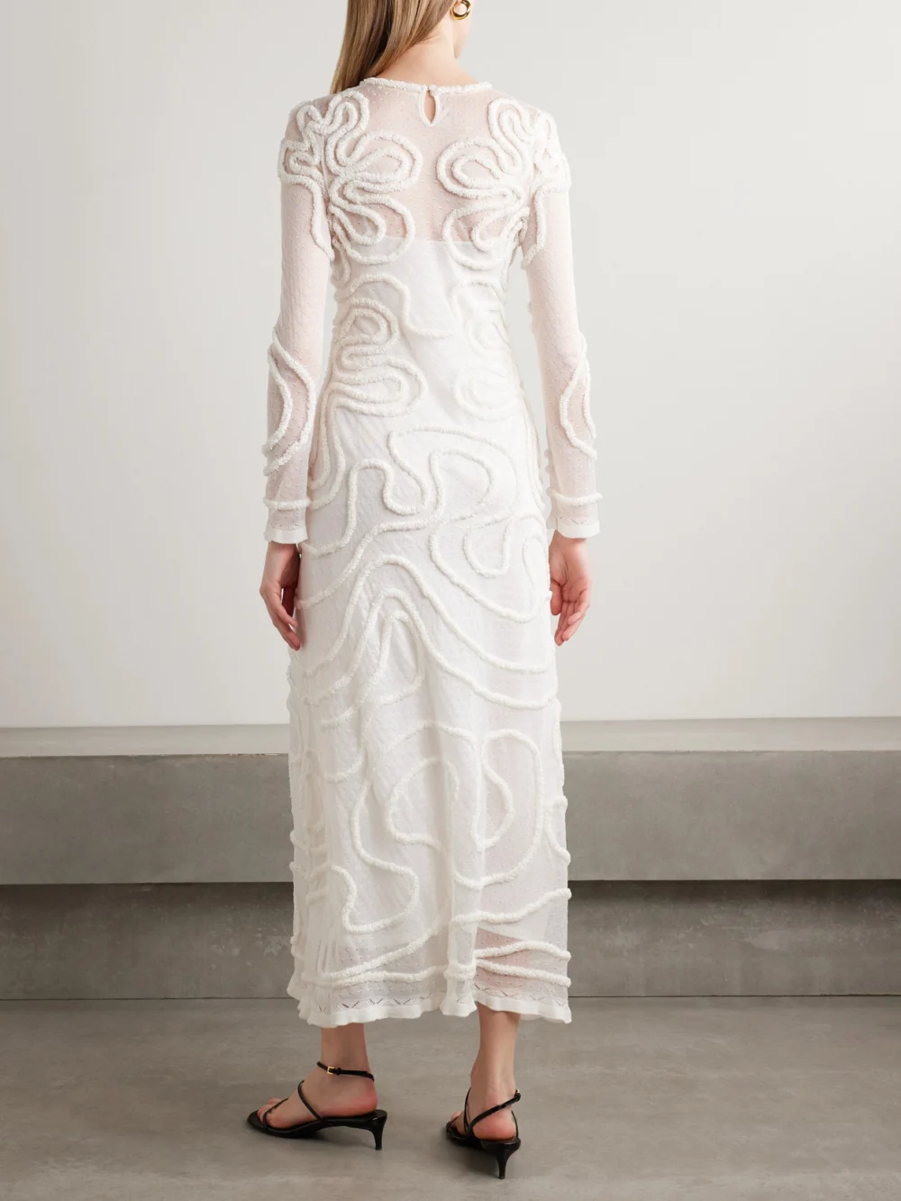 Back view of the Ulla Johnson Valentina Appliquéd Pointelle-knit Midi Dress