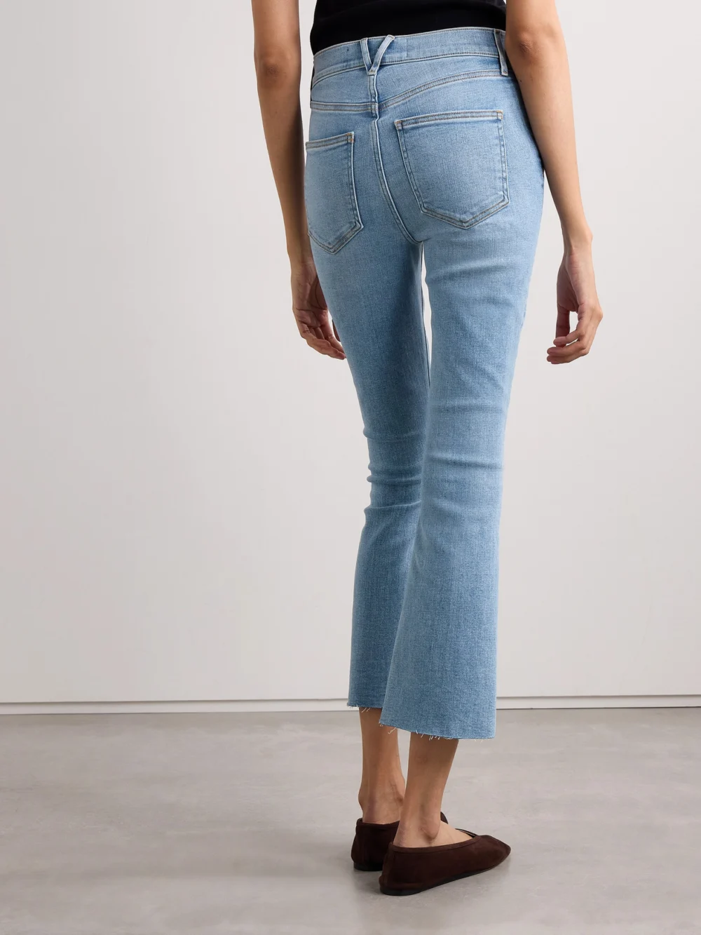 Back view of the Veronica Beard Carolina Cropped High-rise Flared Jeans