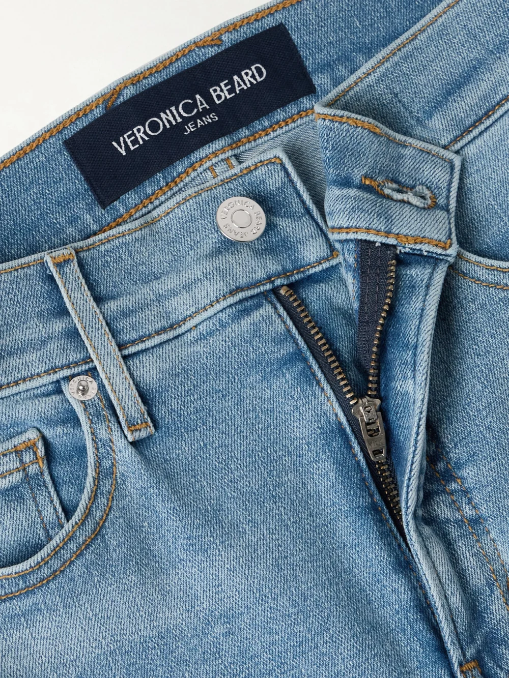 Close-up detail of the Veronica Beard Carolina Cropped High-rise Flared Jeans
