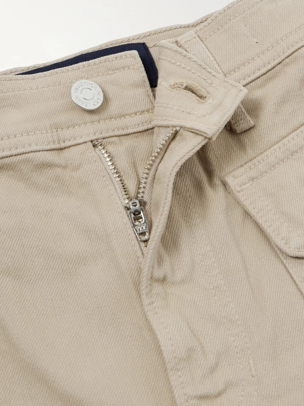 Close-up detail of the Veronica Beard Taylor Cropped High-rise Wide-leg Jeans