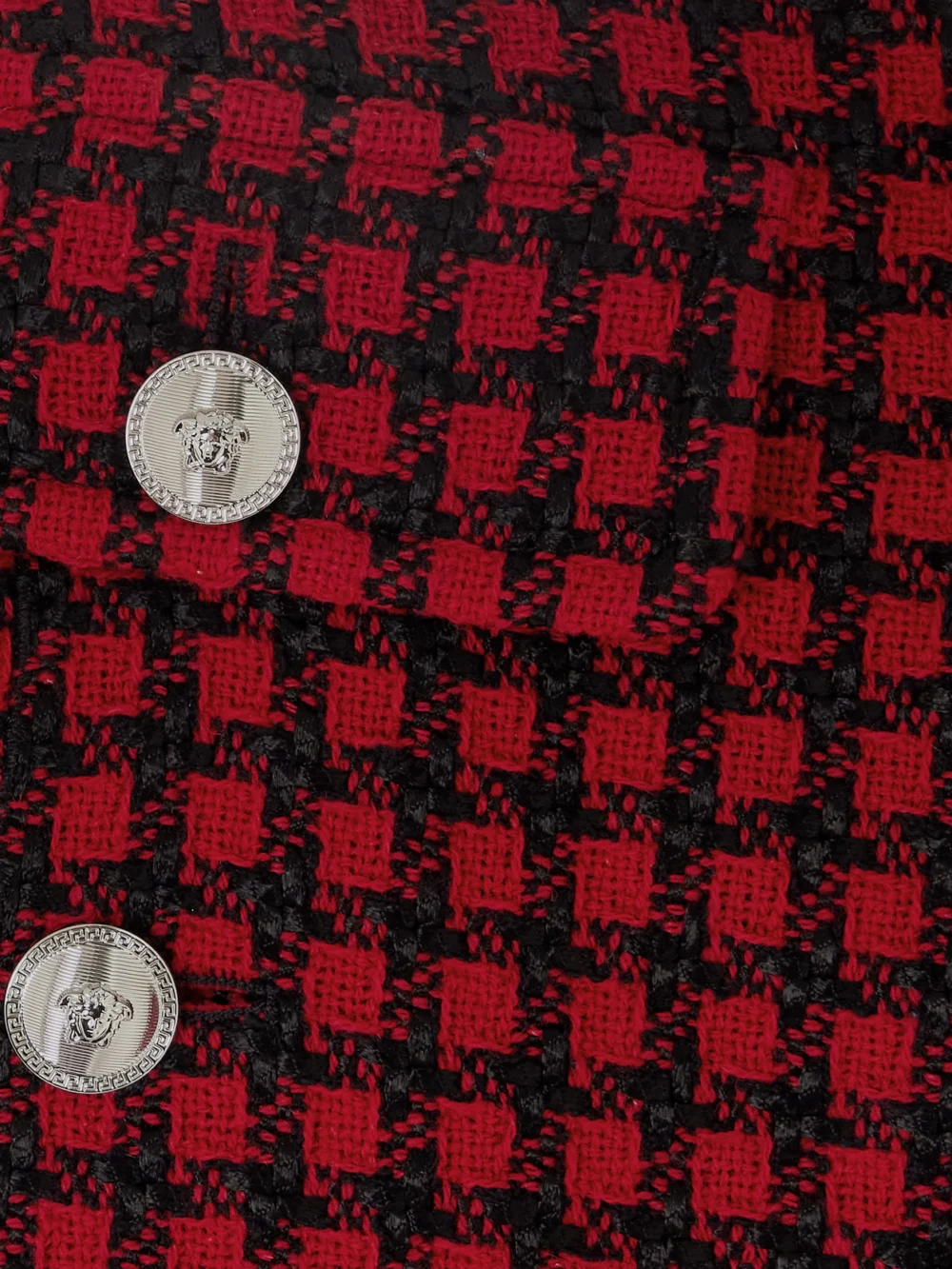 Close-up detail of the Versace Button-embellished Frayed Checked Tweed Mini Skirt