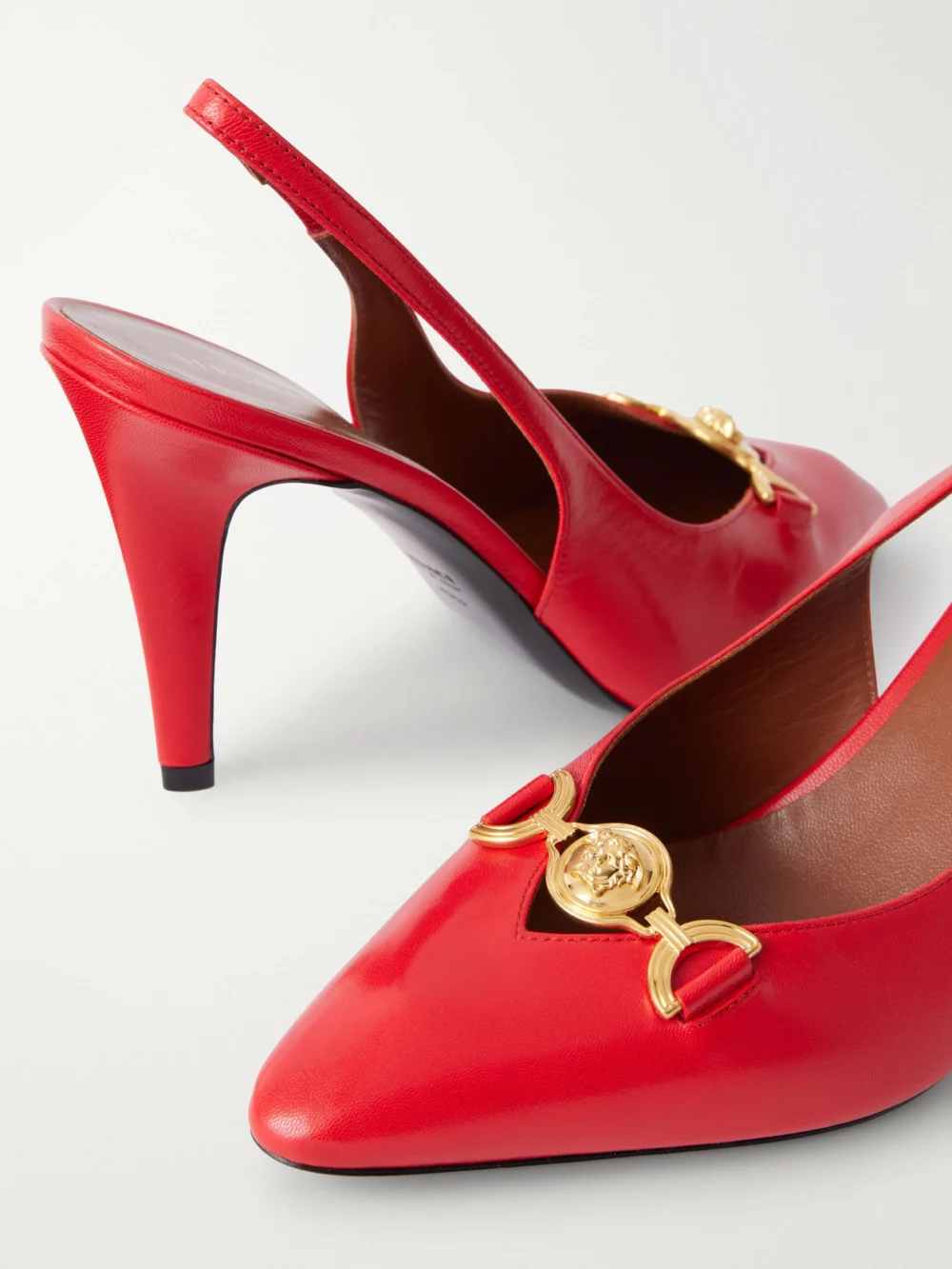 Close-up detail of the Versace Clelia 90 Medusa-embellished Leather Slingback Pumps