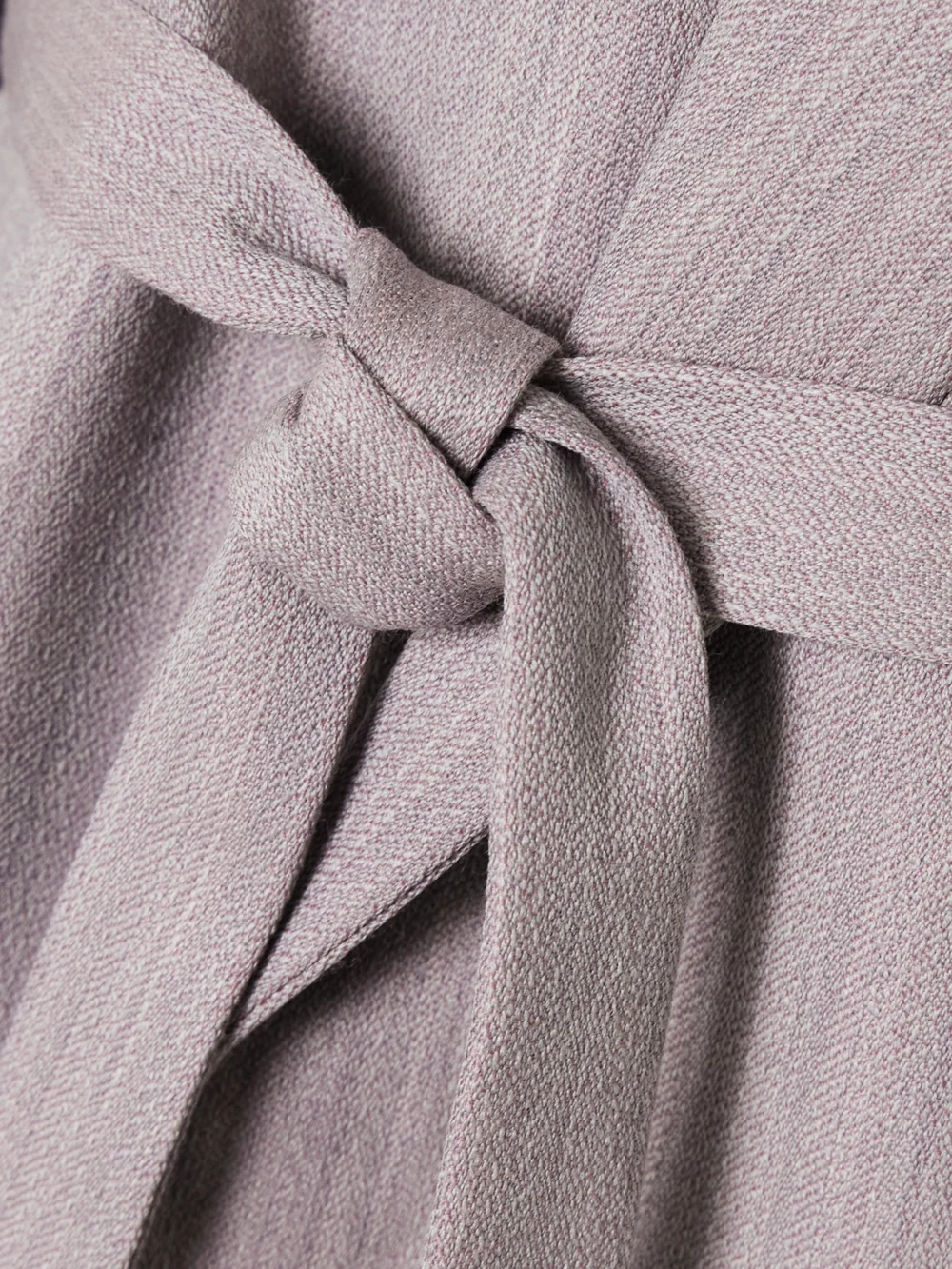 Close-up detail of the Victoria Beckham Belted Textured-wool Blazer