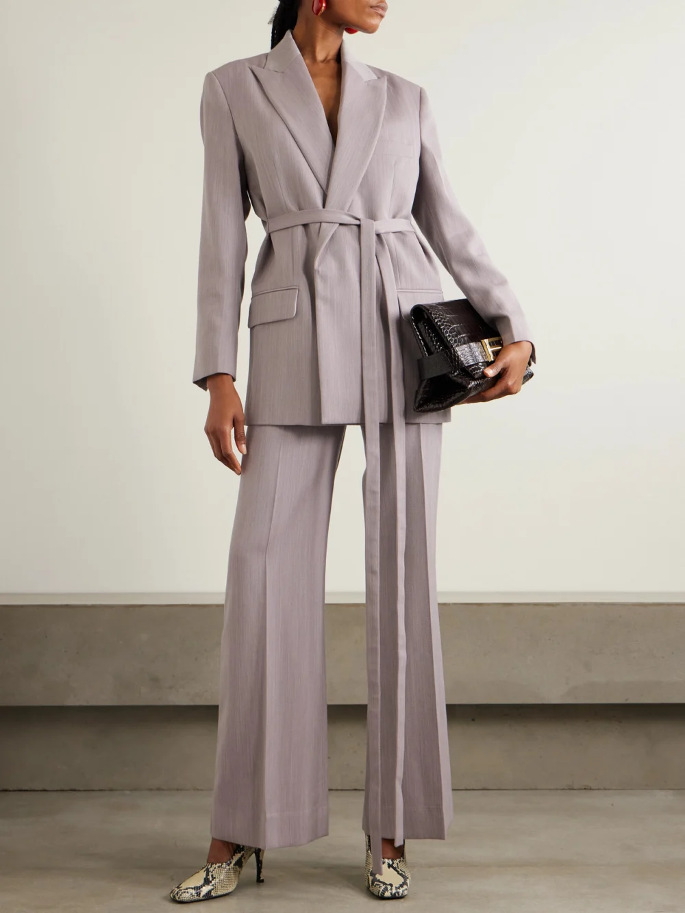 Victoria Beckham Belted Textured-wool Blazer, worn by a model