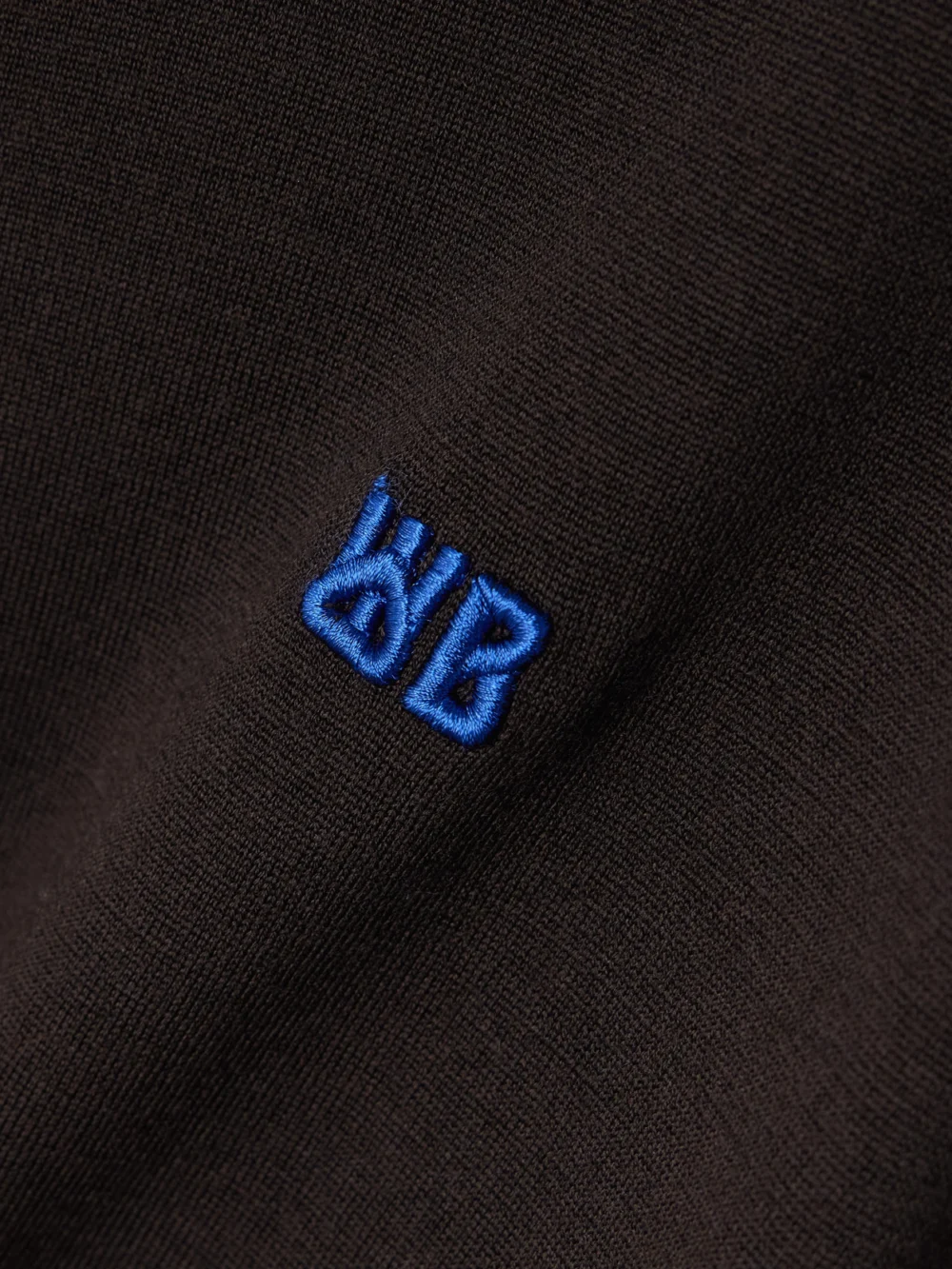 Close-up detail of the Wales Bonner + John Smedley Henry Merino Wool Polo Sweater