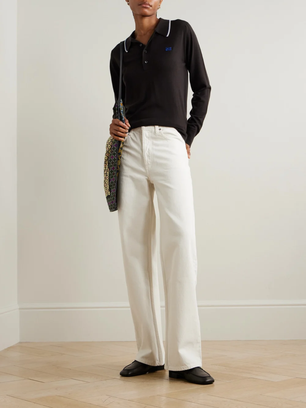 Wales Bonner + John Smedley Henry Merino Wool Polo Sweater, worn by a model