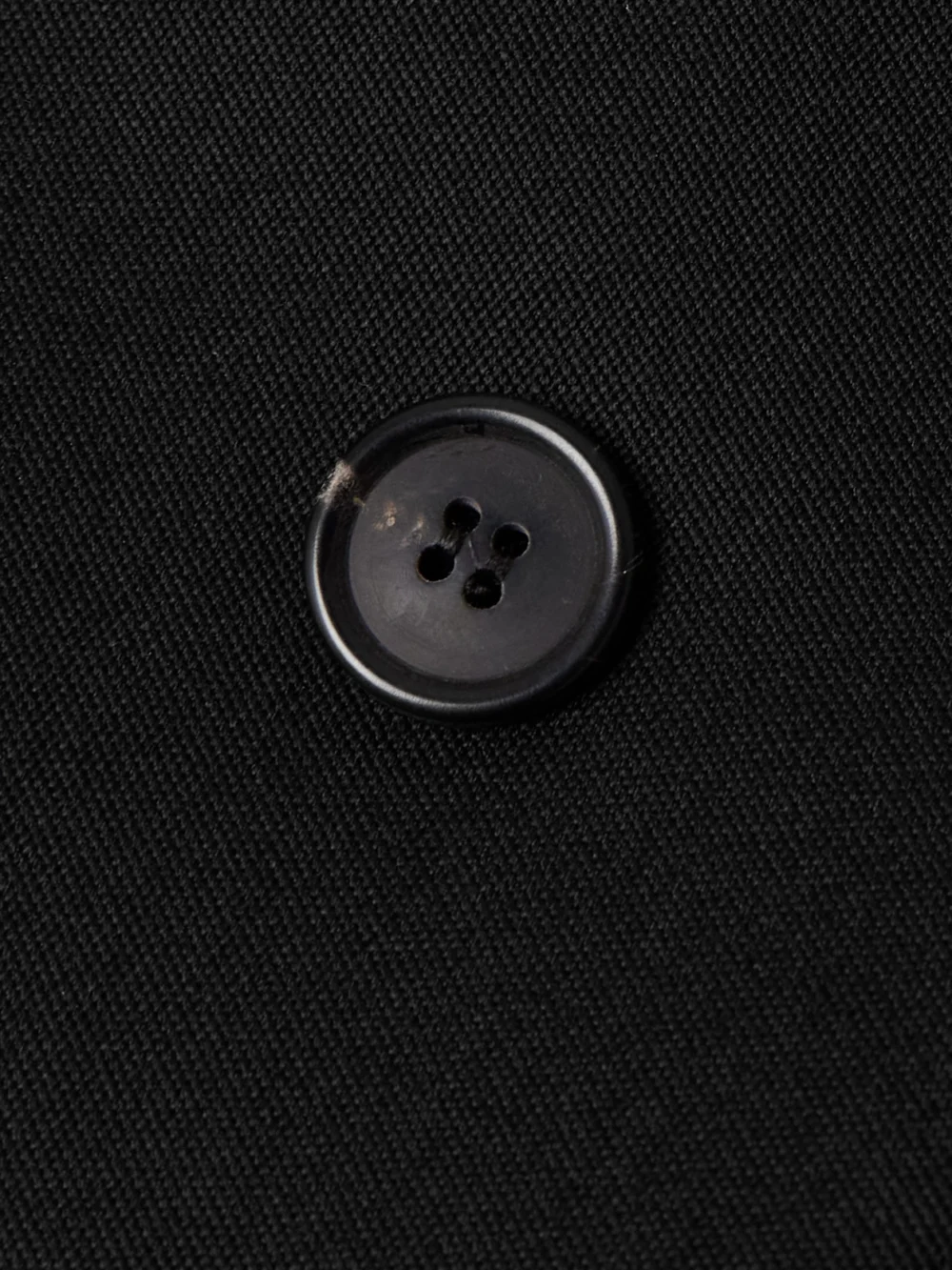 Close-up detail of the WARDROBE.NYC + Rhw Double-breasted Twill Mini Dress