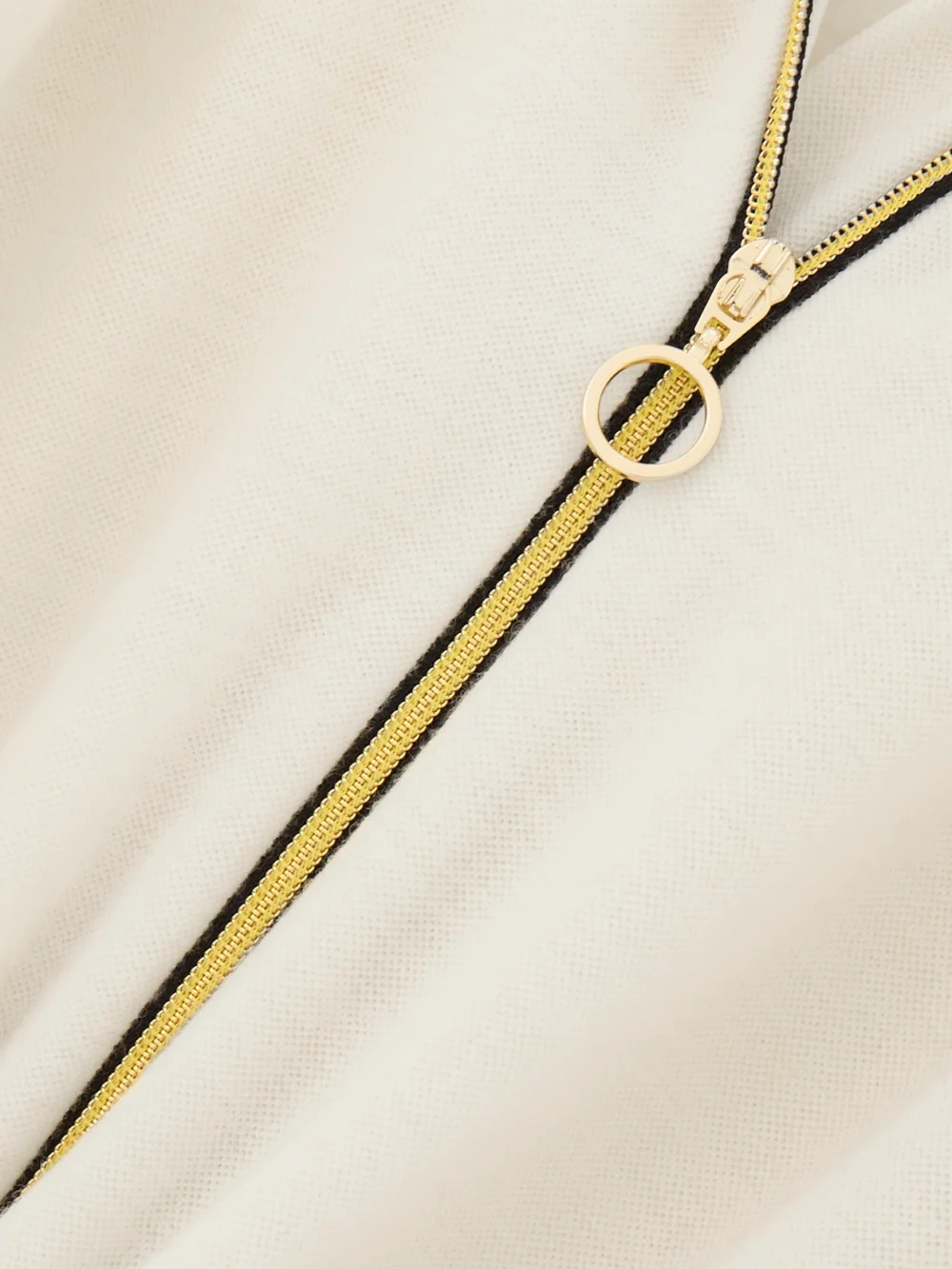 Close-up detail of the We Norwegians + Inuikii Merino Wool-blend Piqué Jumpsuit