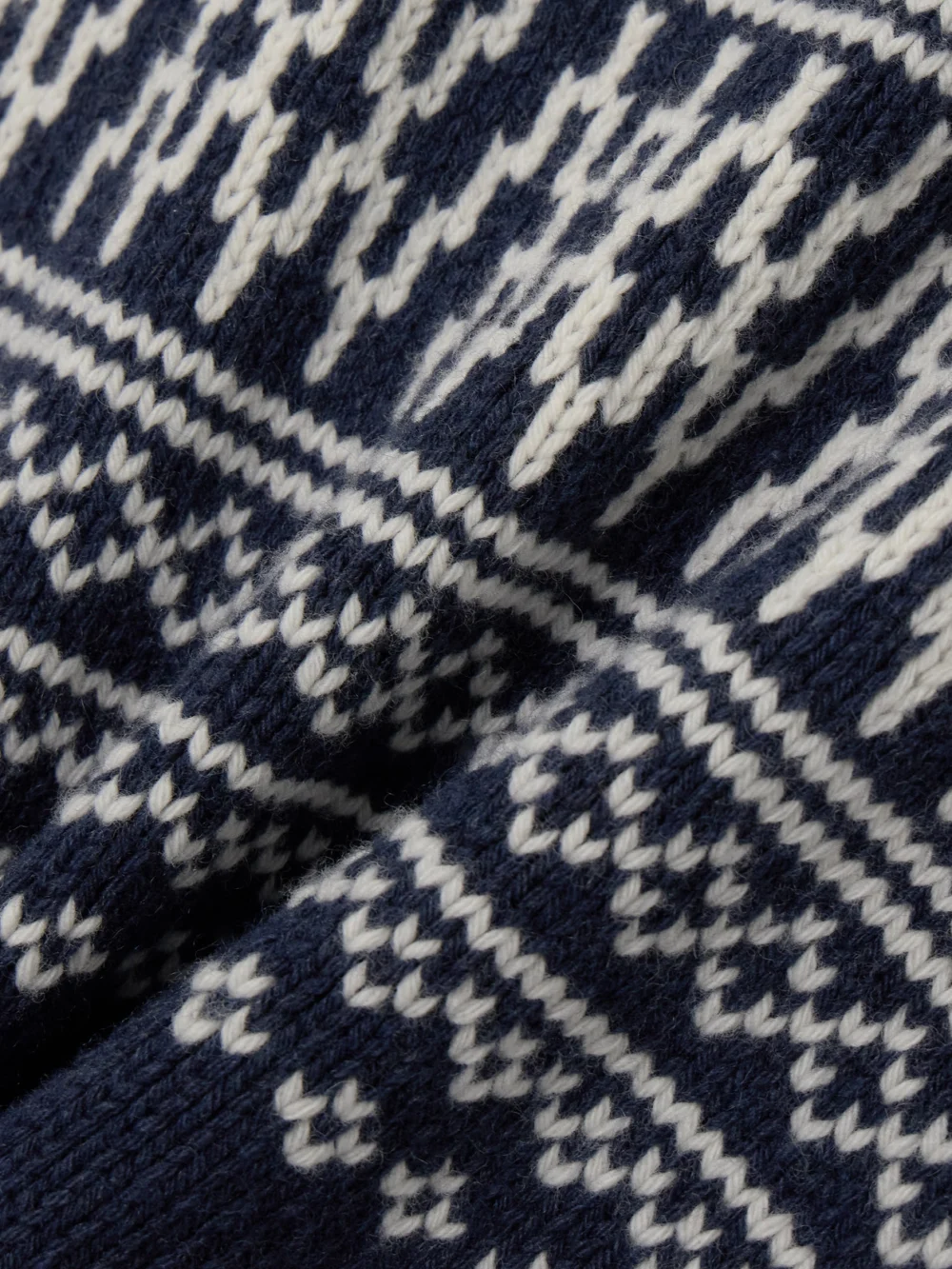 Close-up detail of the We Norwegians Setesdal Merino Wool and Cashmere-blend Turtleneck Vest