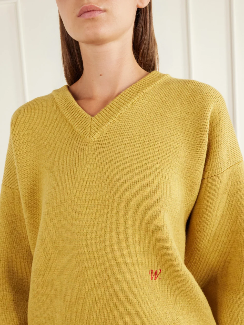 Close-up detail of the Willy Chavarria Chavarria Logo-embroidered Rib-trimmed Wool Sweater