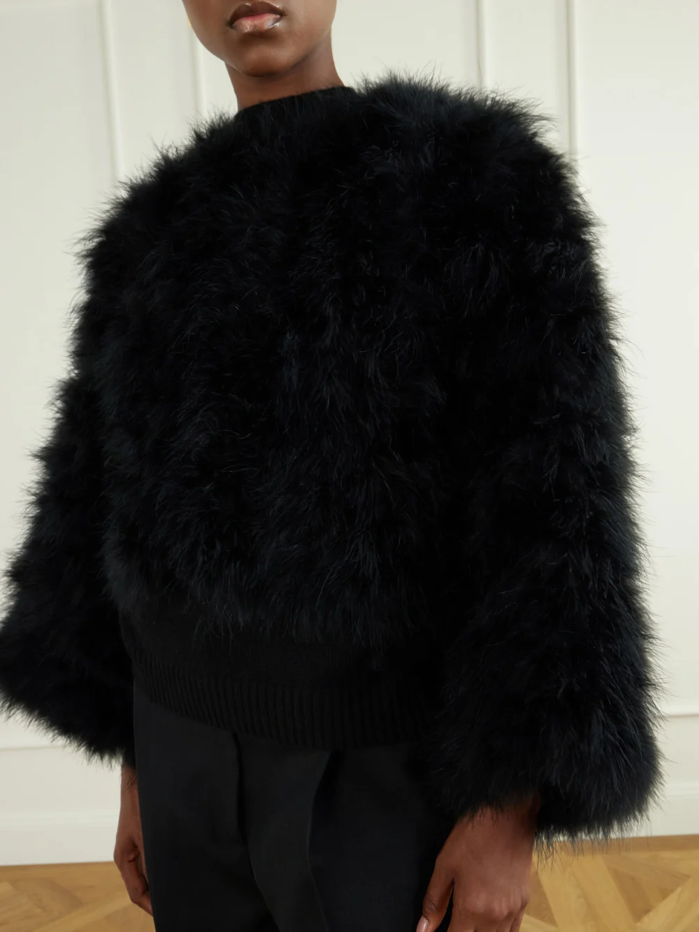 Close-up detail of the Yves Salomon Cropped Feather-trimmed Satin Cape