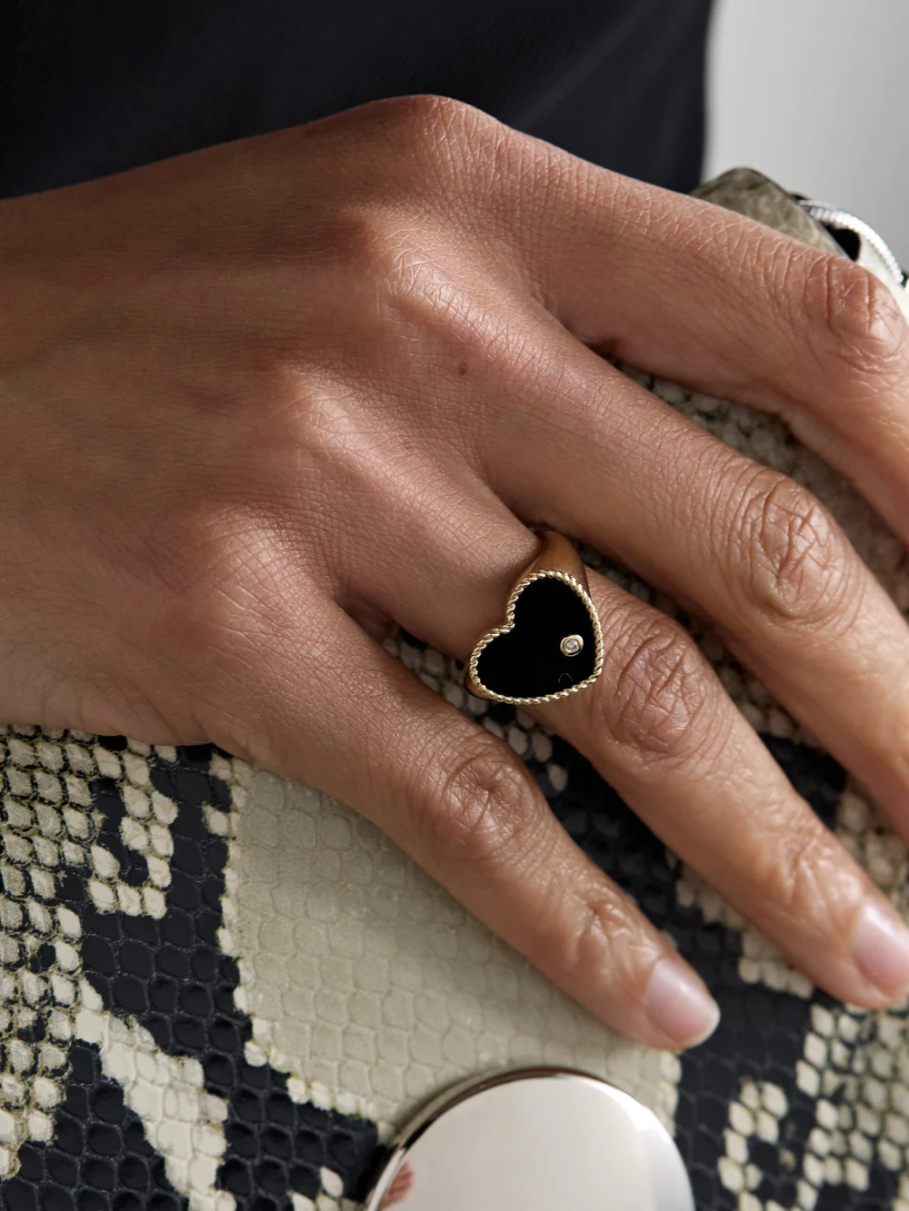 Yvonne Léon Chevalière Coeur 9-karat Gold, Onyx and Diamond Ring, styled view
